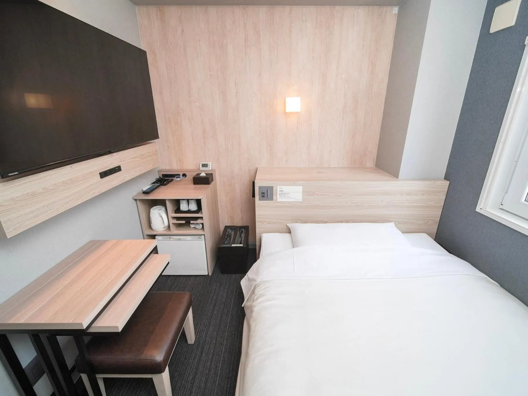 Bed in Super Hotel Hiroshima