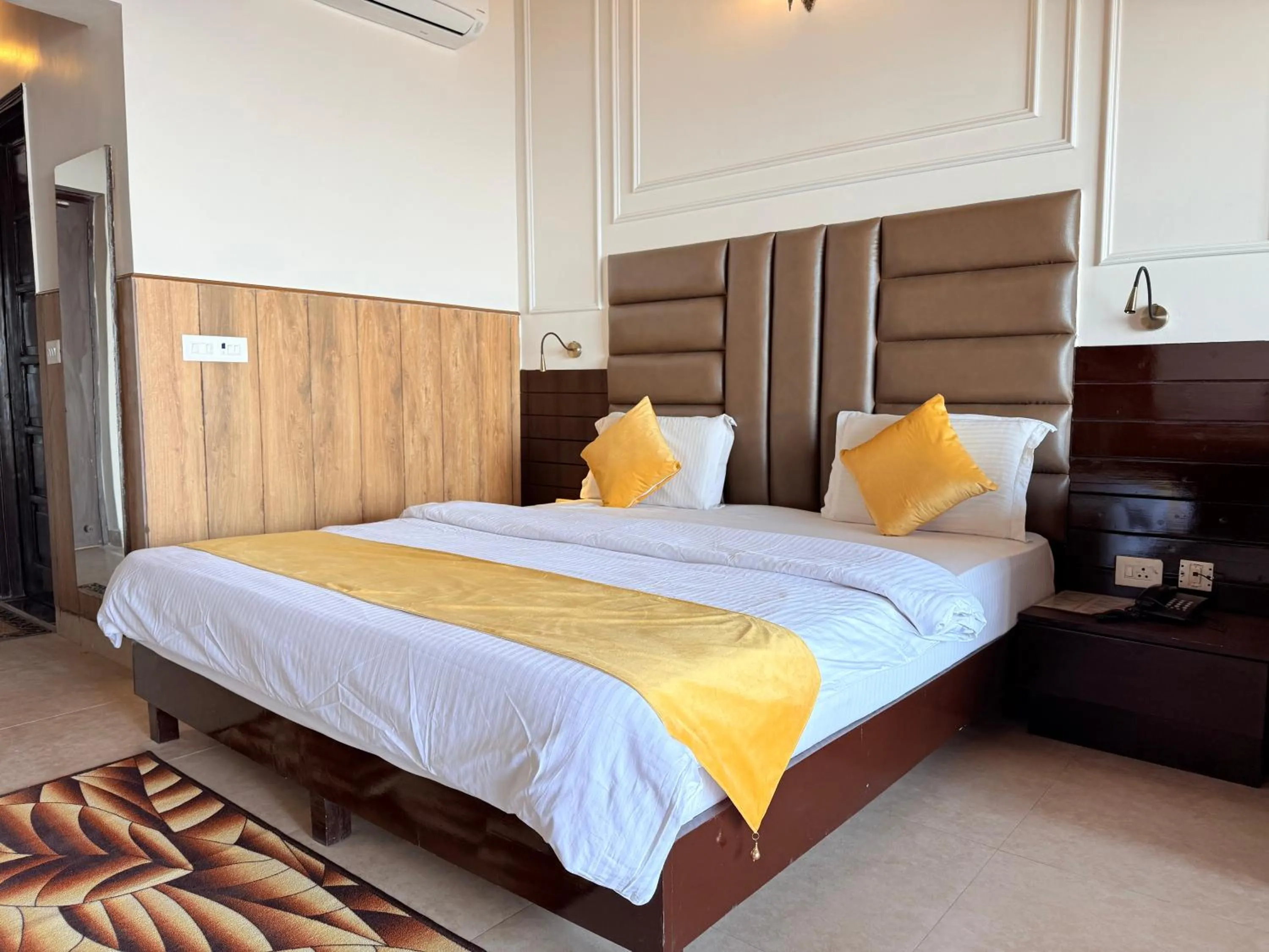 Bed in ECKO Kasang Regency Hill Resort