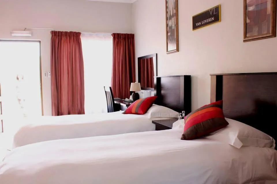 Bed in The Lazy Grape Guest Lodge & Spa