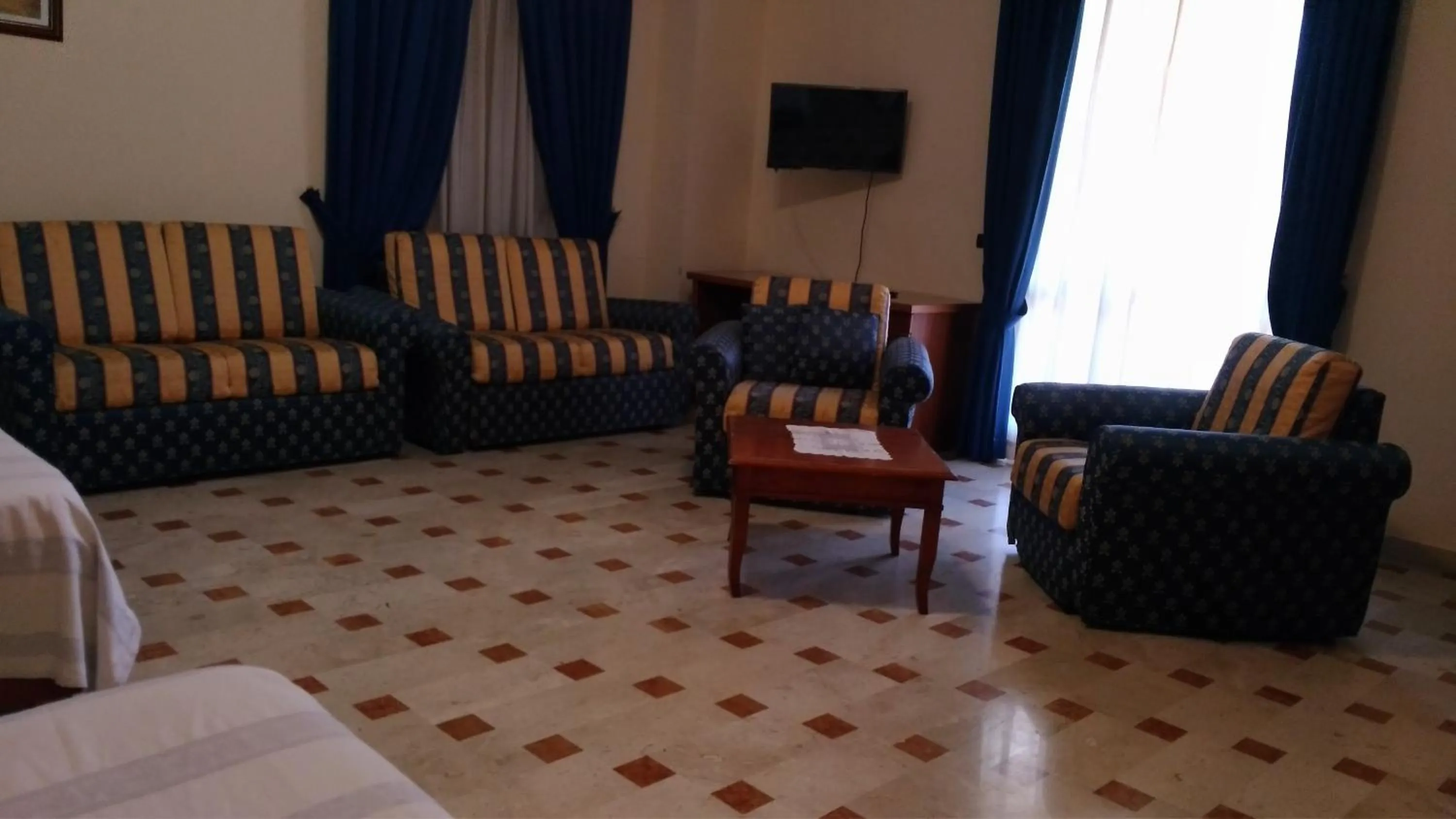 Living room, Bed in Hotel La Falconara