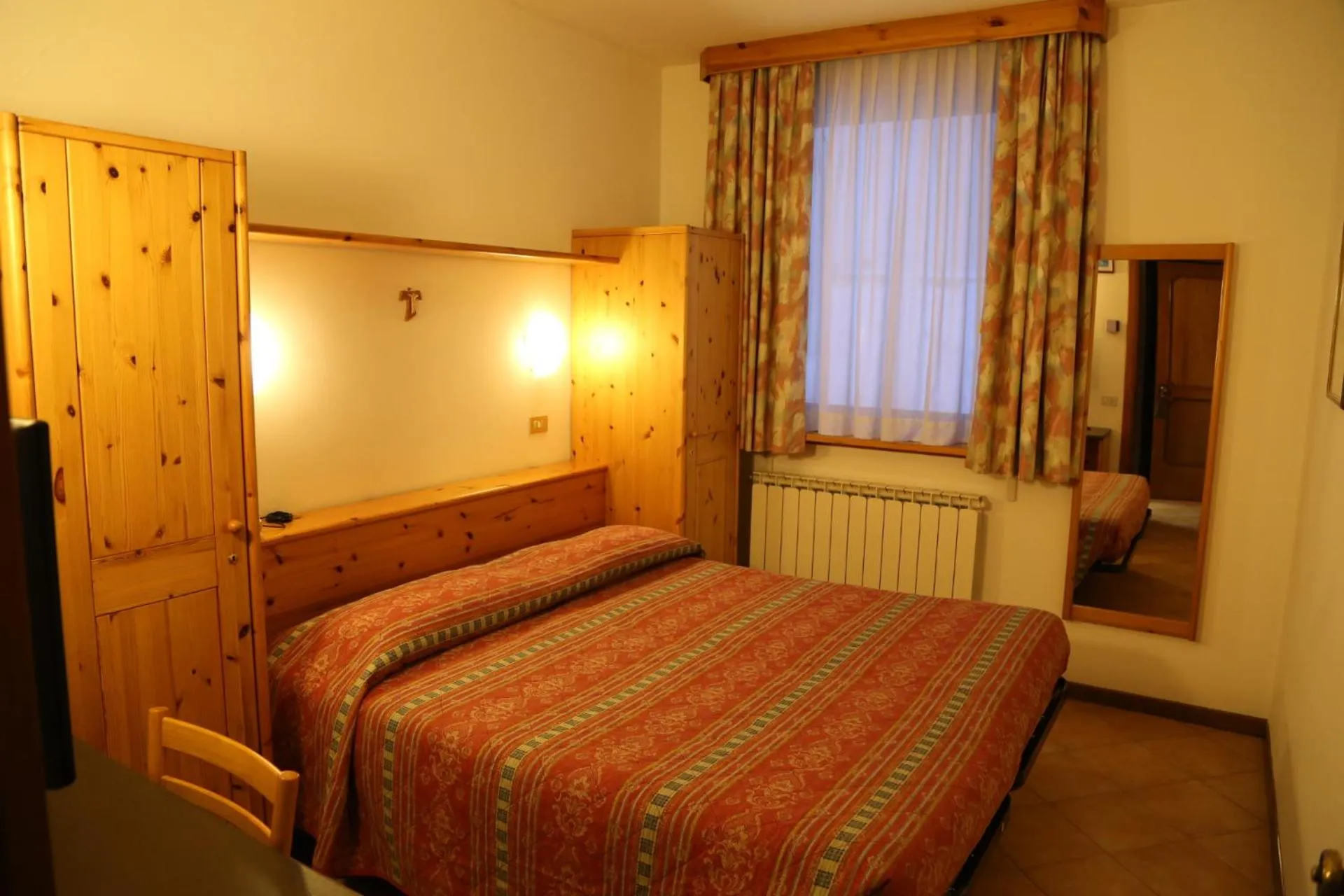 Bed in Hotel Dolomiti