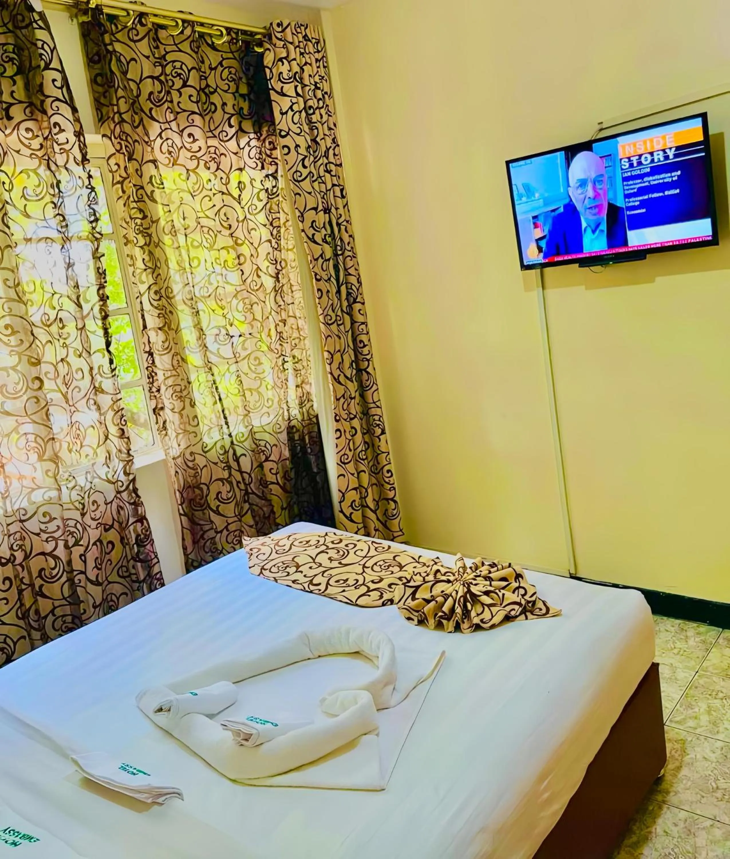 Bed in Hotel Embassy