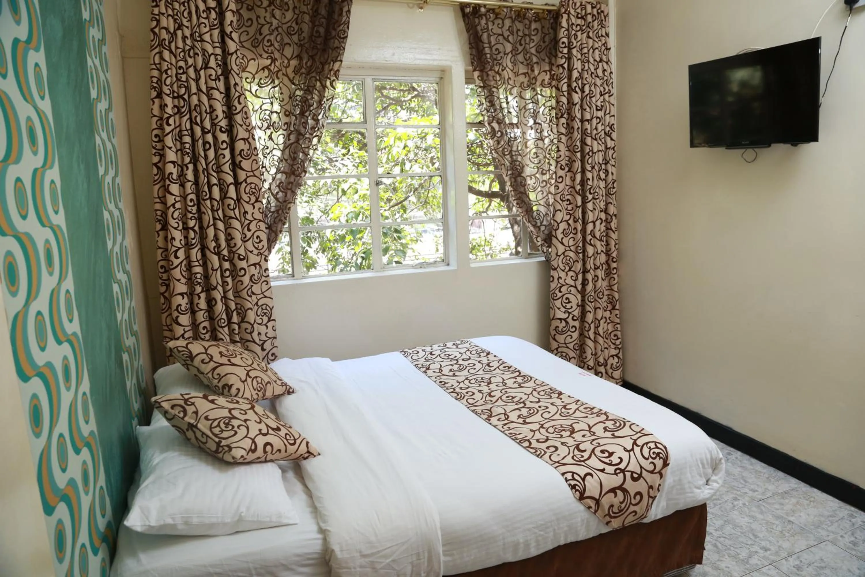 Bed in Hotel Embassy