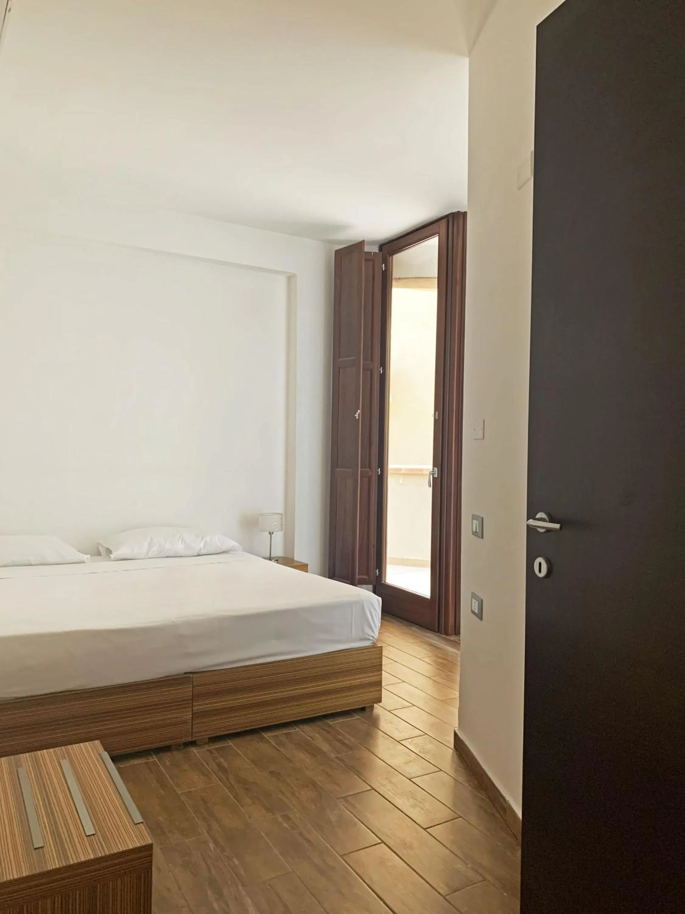 Bed in Nuraghe Apartments