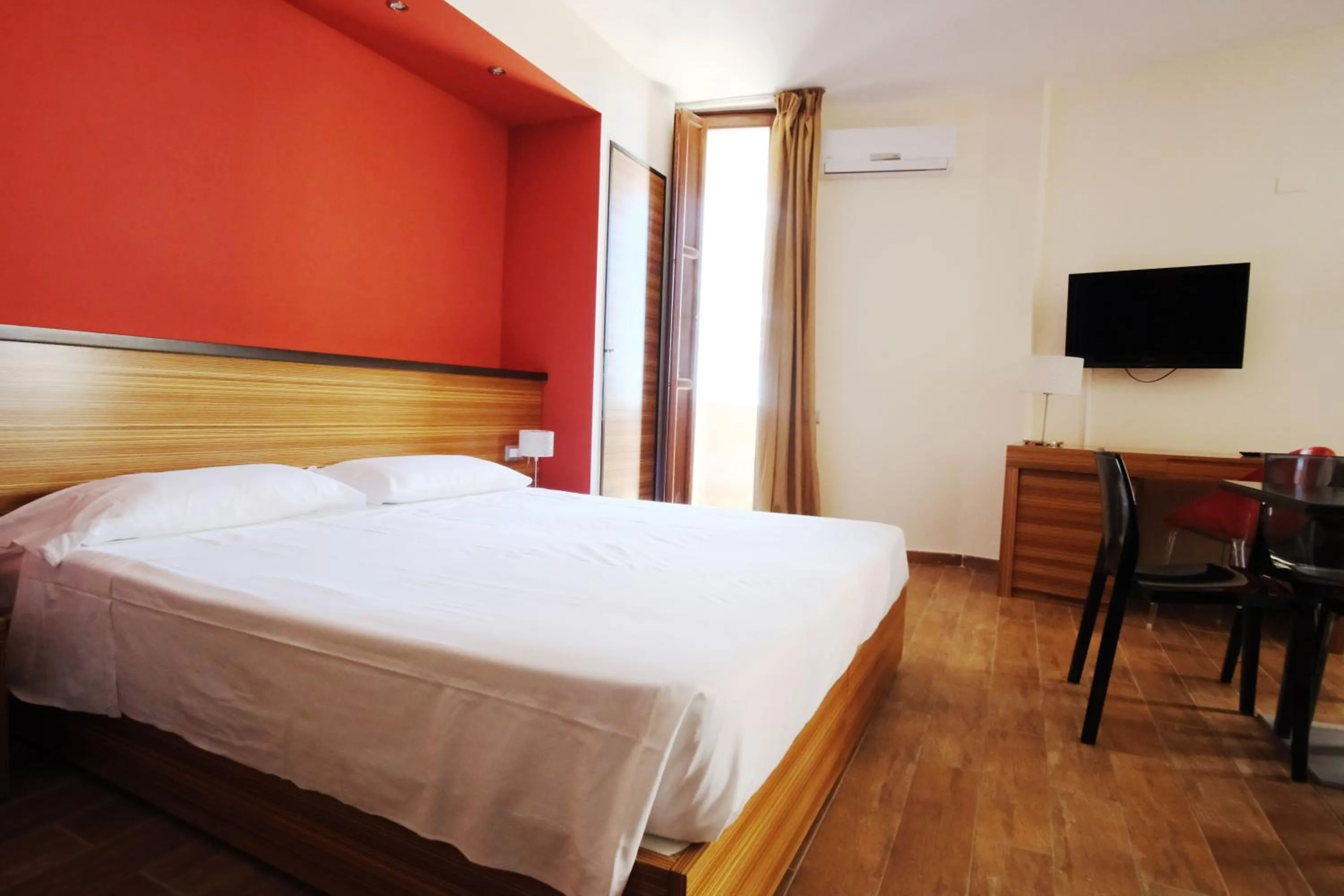 Bed in Nuraghe Apartments