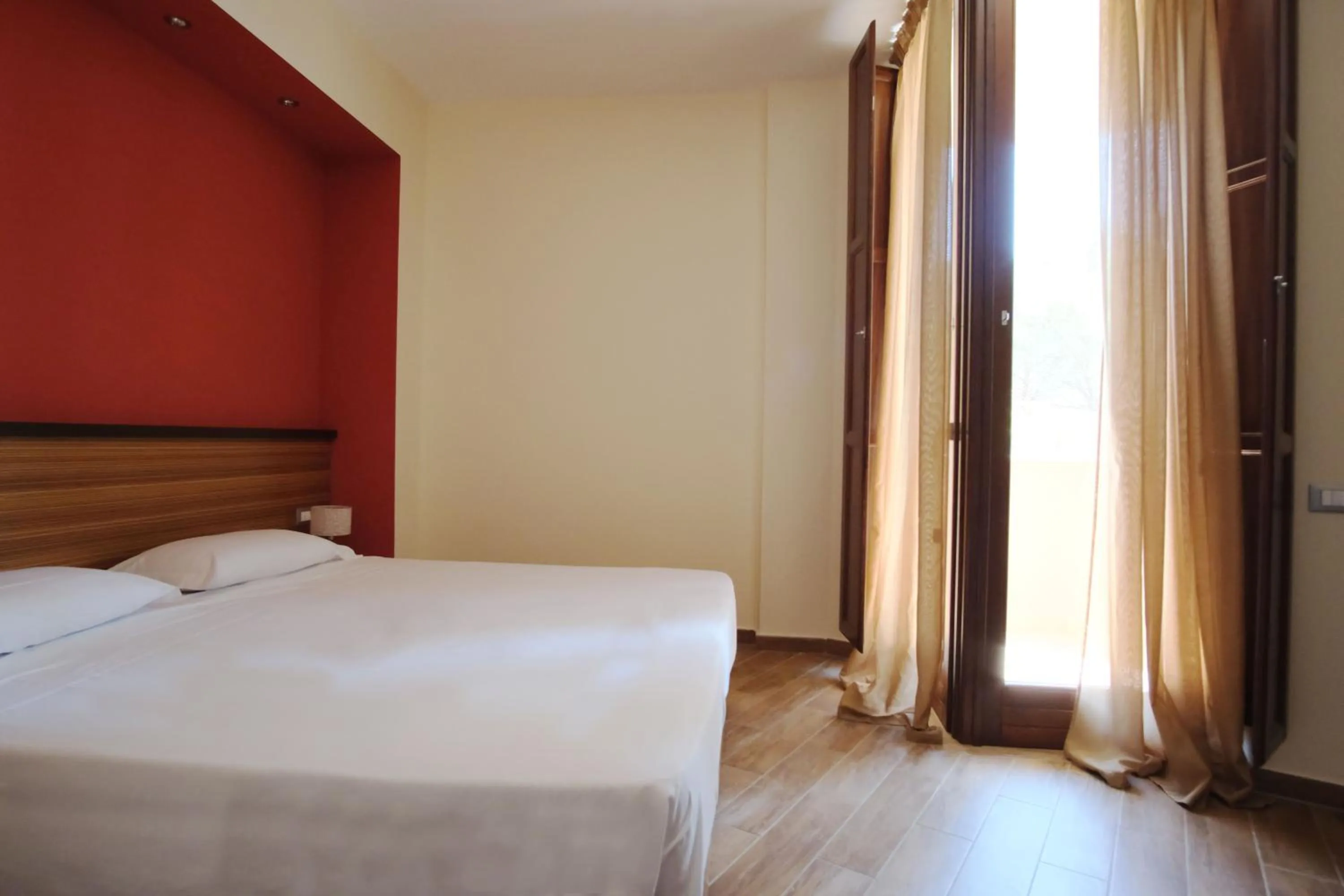 Bed in Nuraghe Apartments