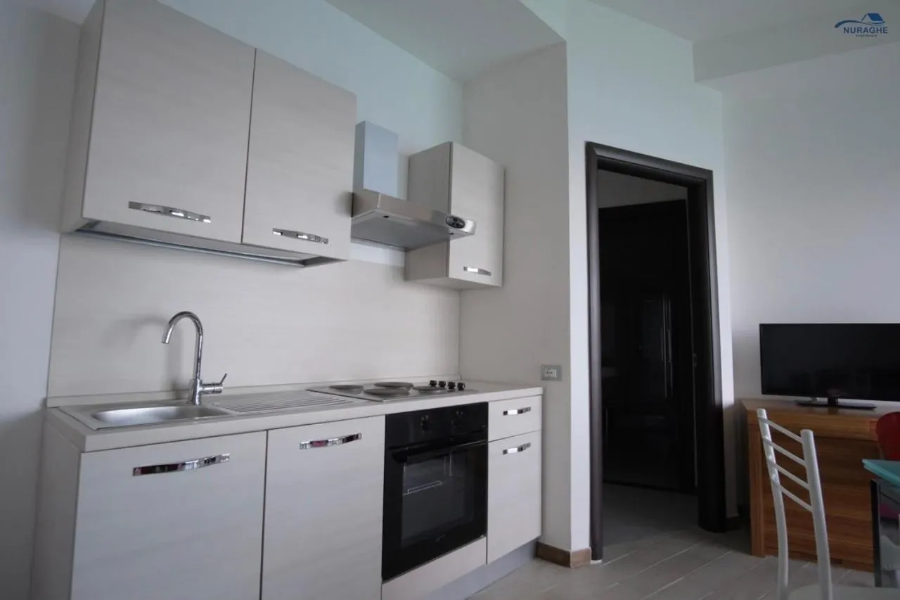kitchen in Nuraghe Apartments