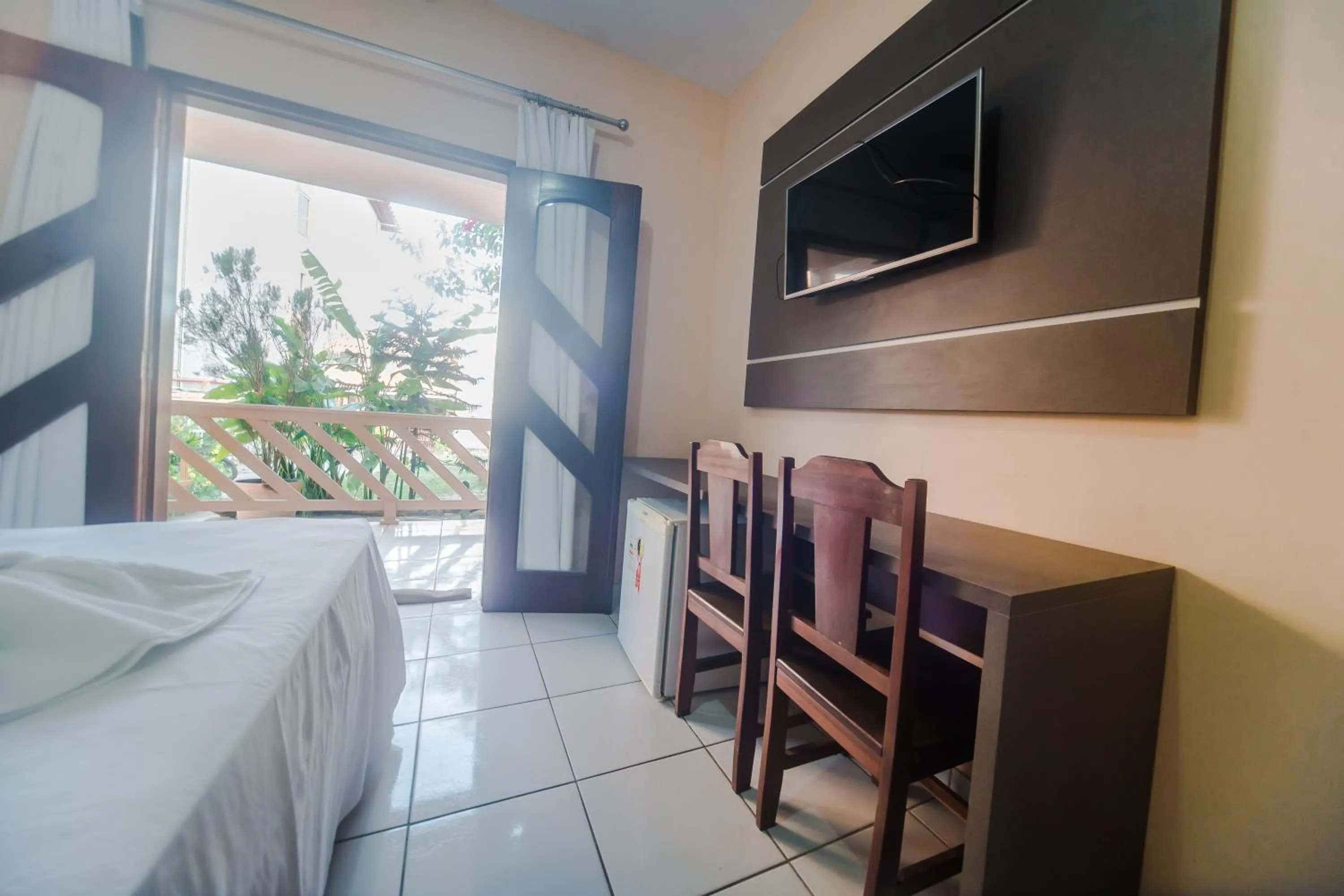 Communal lounge/ TV room, Bed in Pousada D' Areia