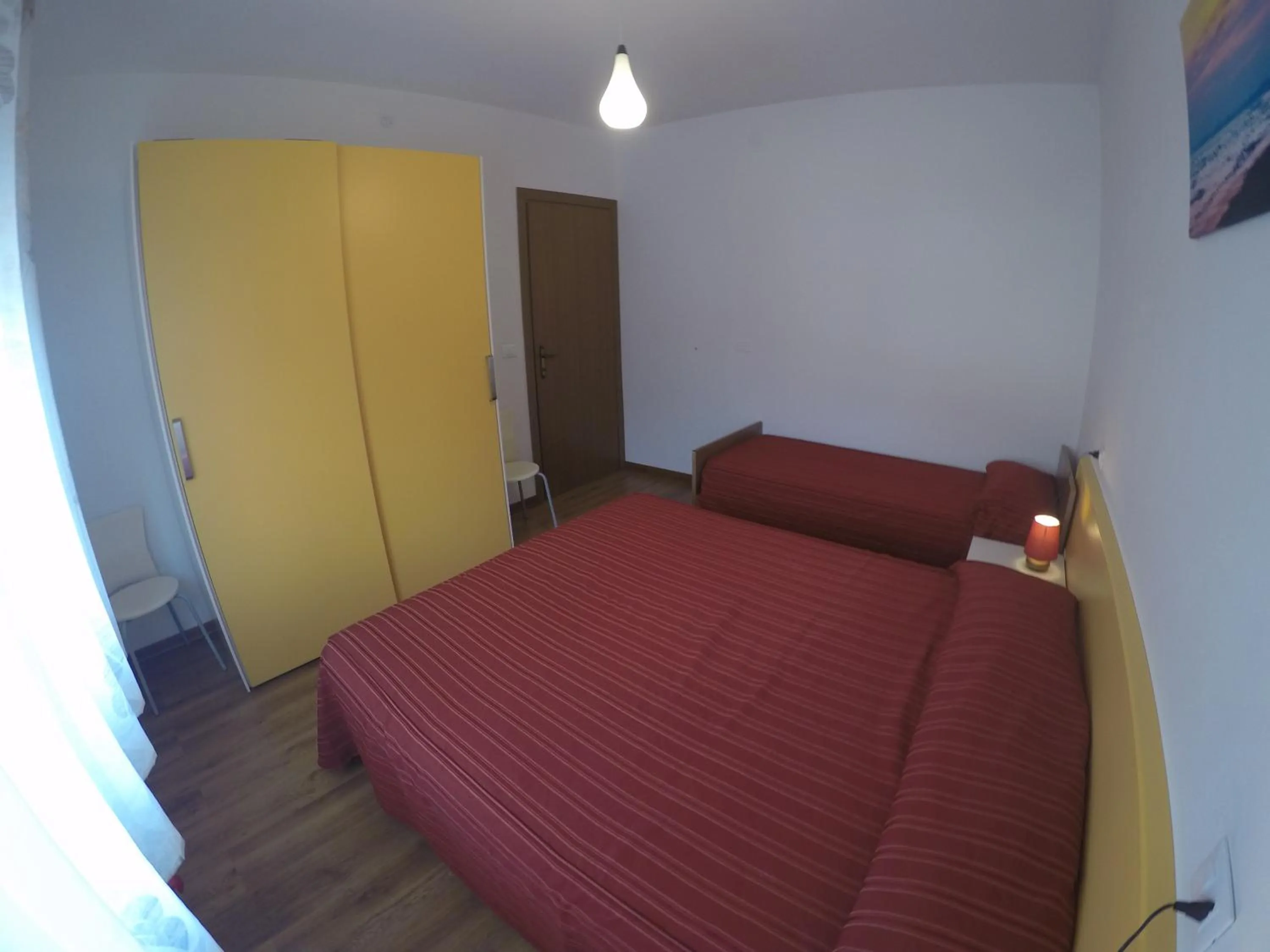Bedroom in Residence Caorle Apartments - Agenzia Cocal
