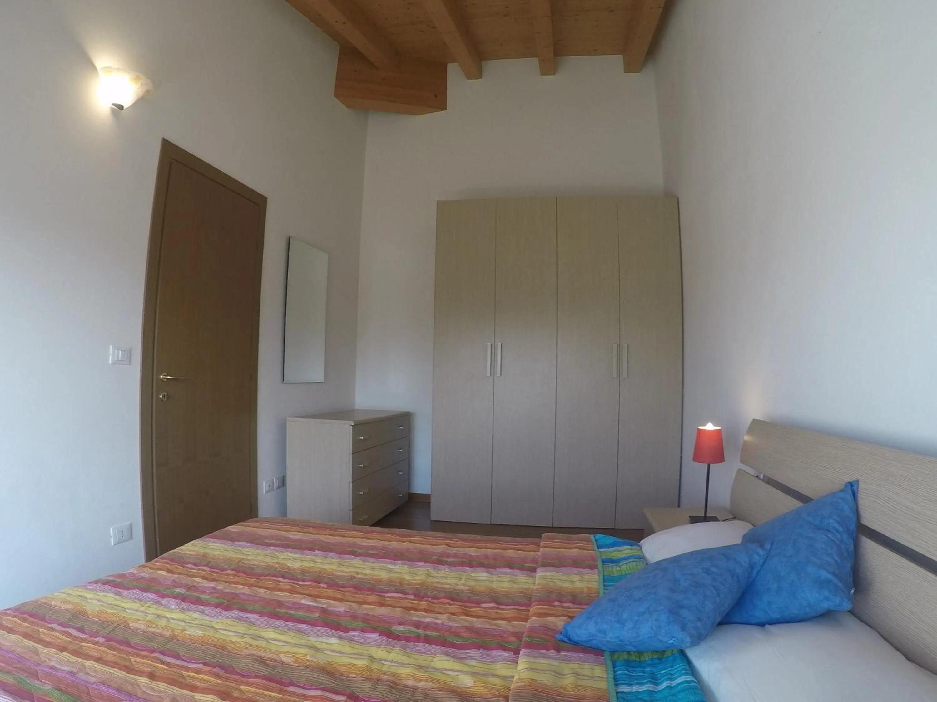 Bedroom in Residence Caorle Apartments - Agenzia Cocal