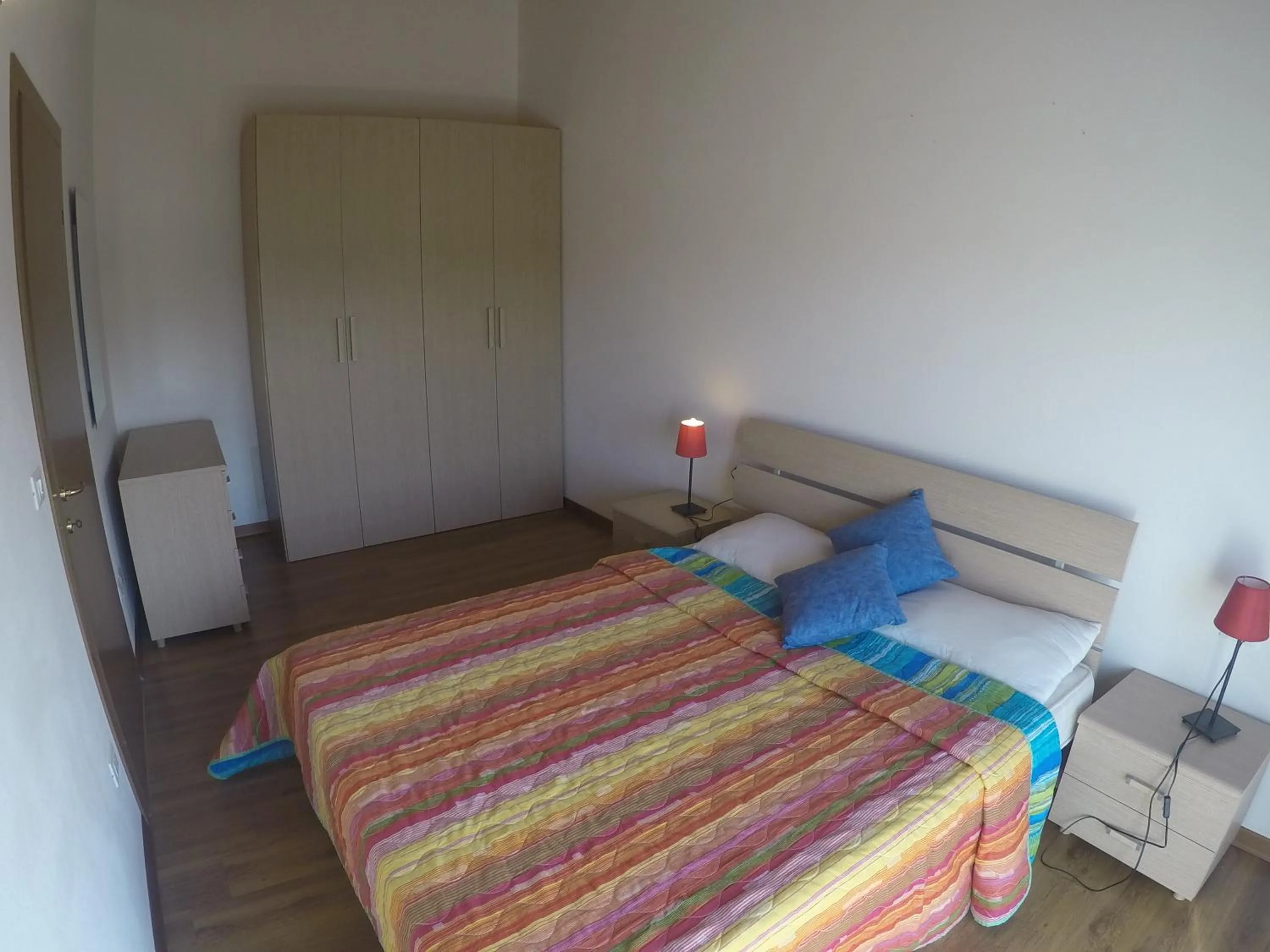 Bedroom in Residence Caorle Apartments - Agenzia Cocal