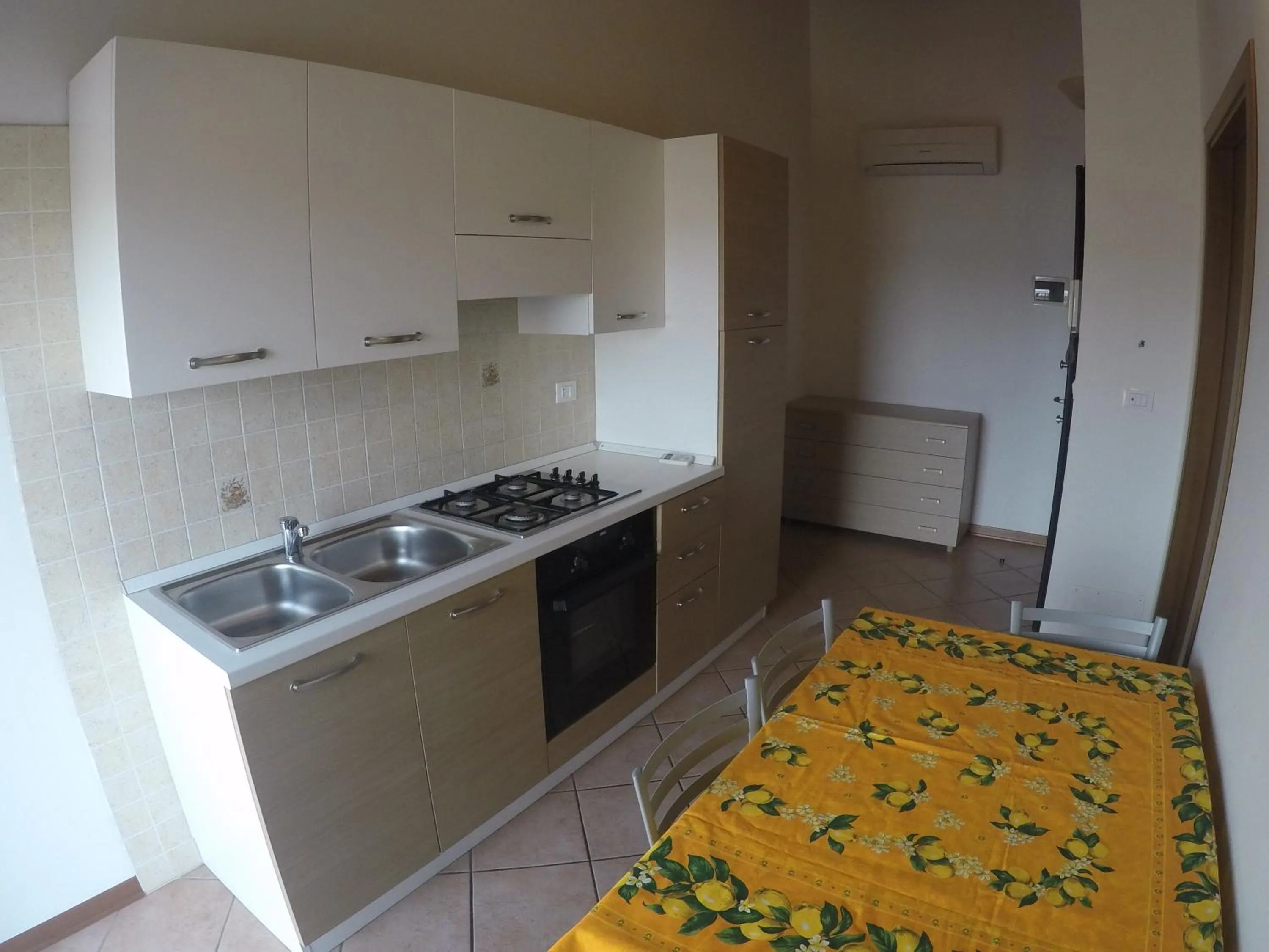 Kitchen or kitchenette in Residence Caorle Apartments - Agenzia Cocal