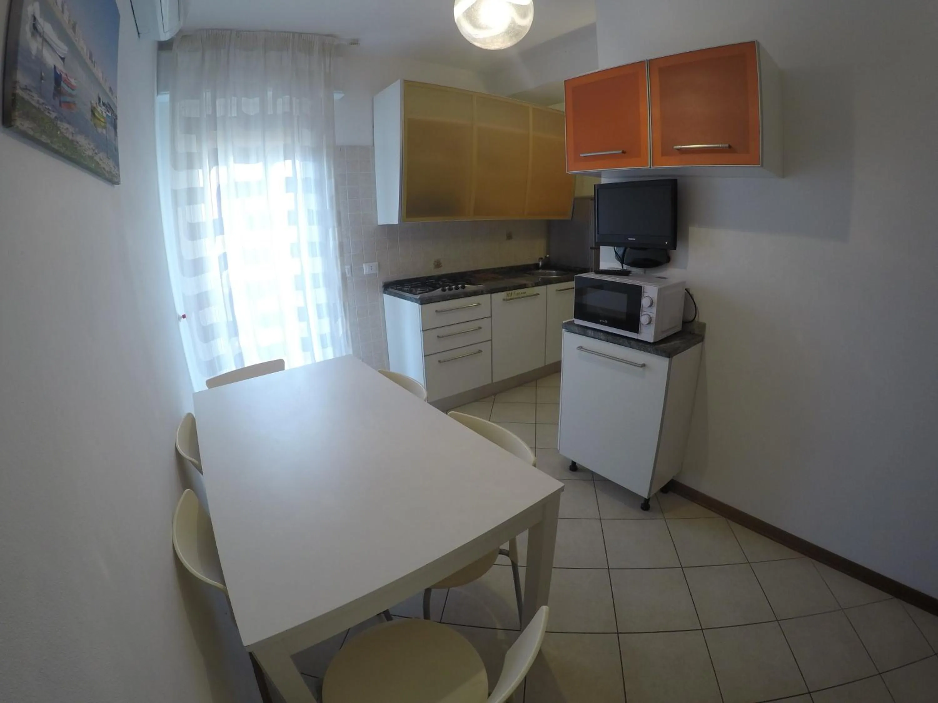 Kitchen or kitchenette in Residence Caorle Apartments - Agenzia Cocal