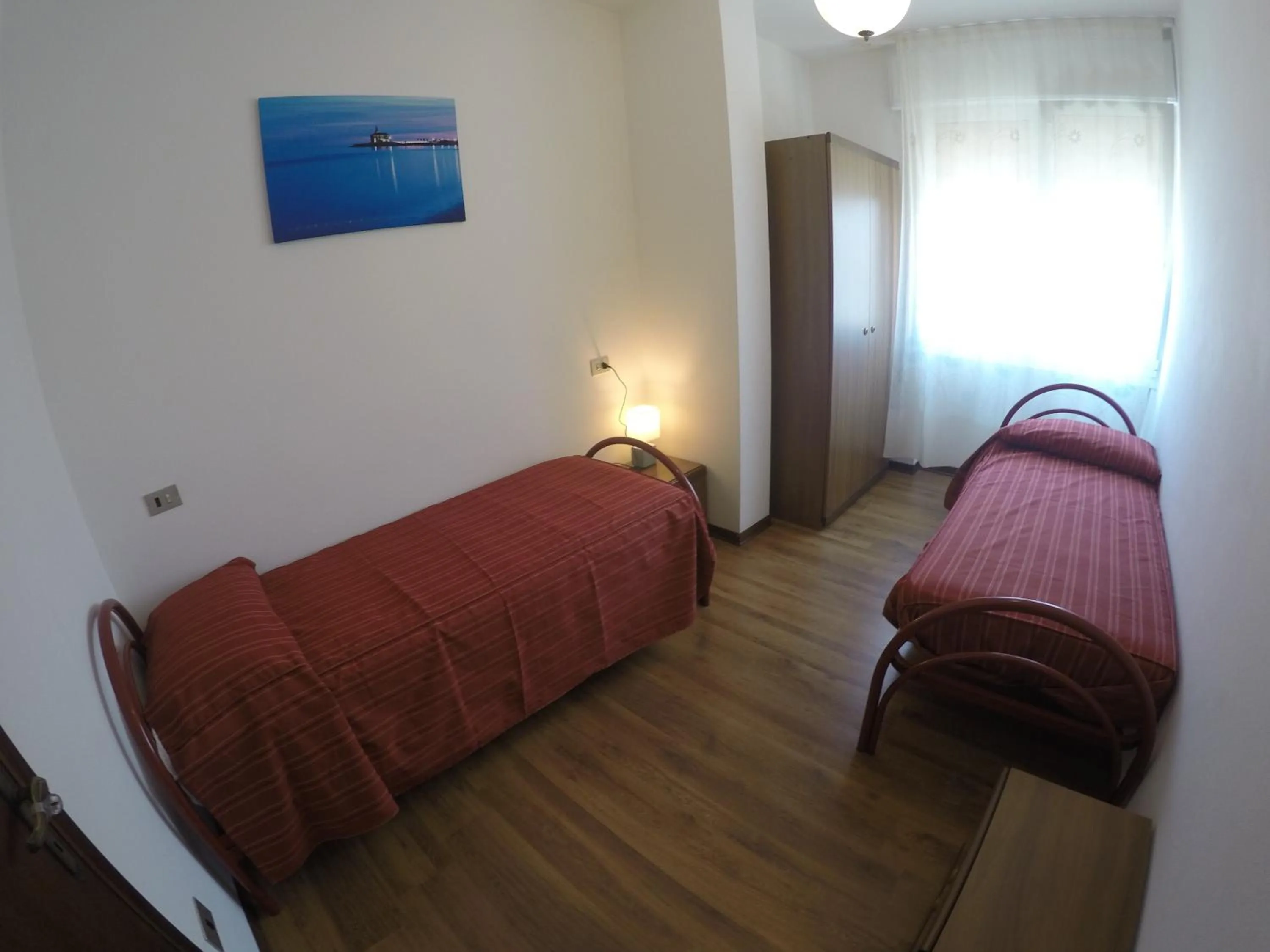 Bedroom in Residence Caorle Apartments - Agenzia Cocal