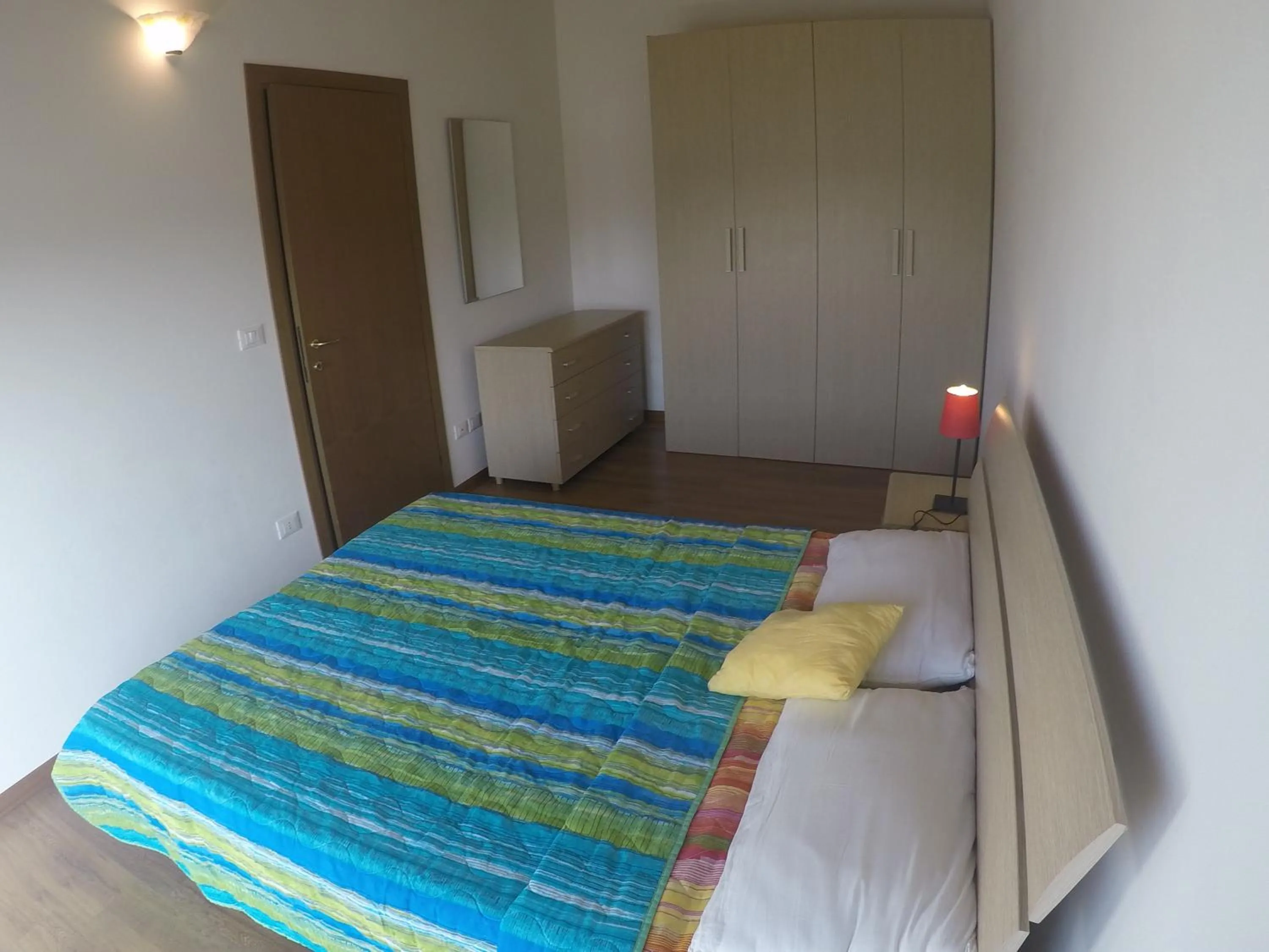 Bedroom in Residence Caorle Apartments - Agenzia Cocal