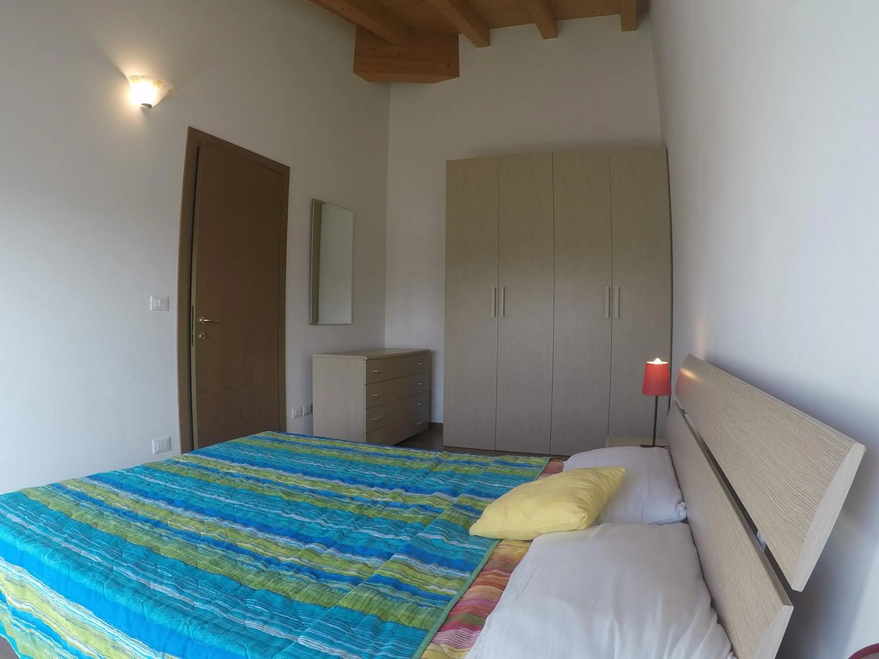 Bedroom in Residence Caorle Apartments - Agenzia Cocal