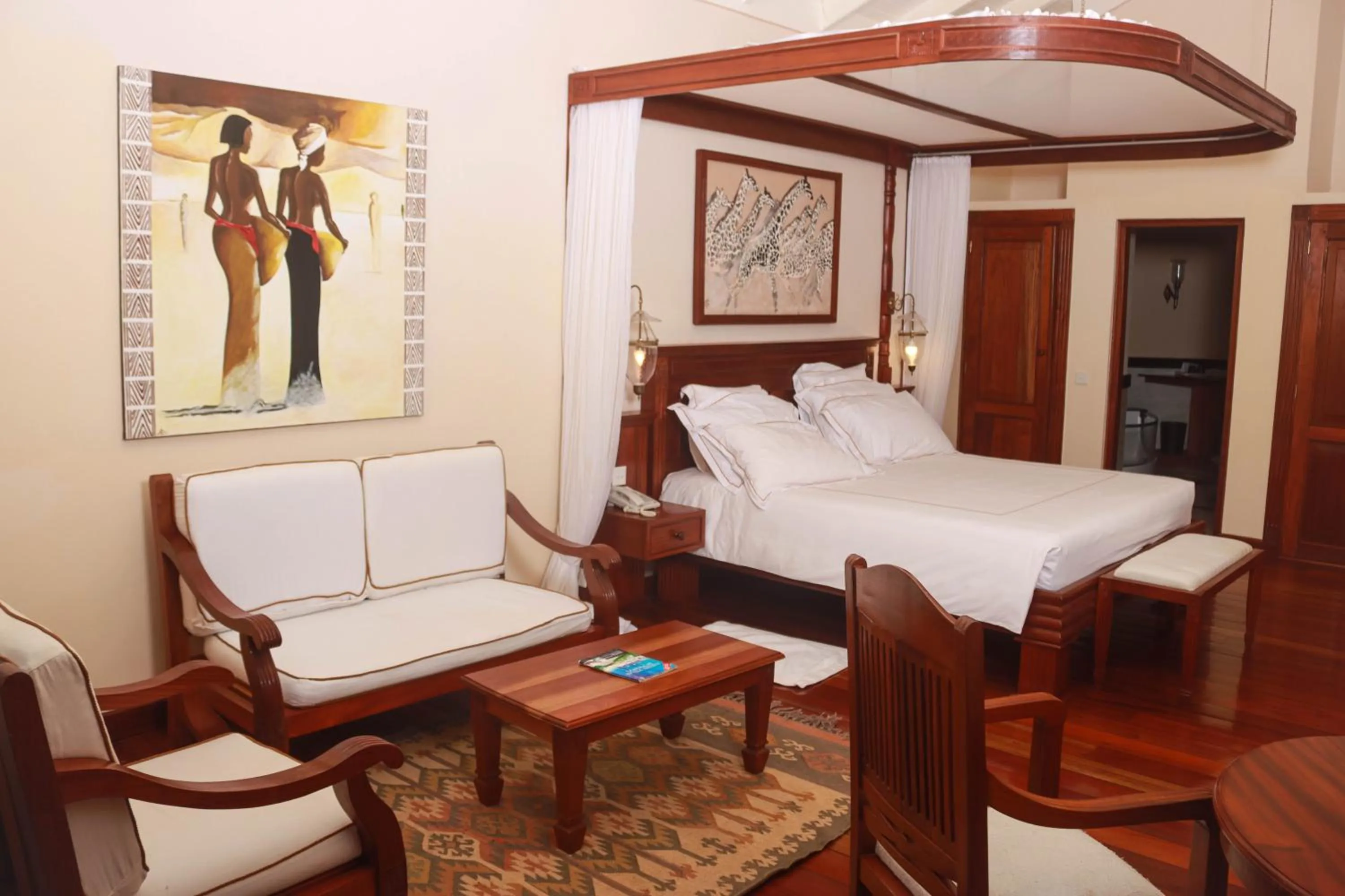 Seating area, Bed in Ocean Beach Resort & SPA