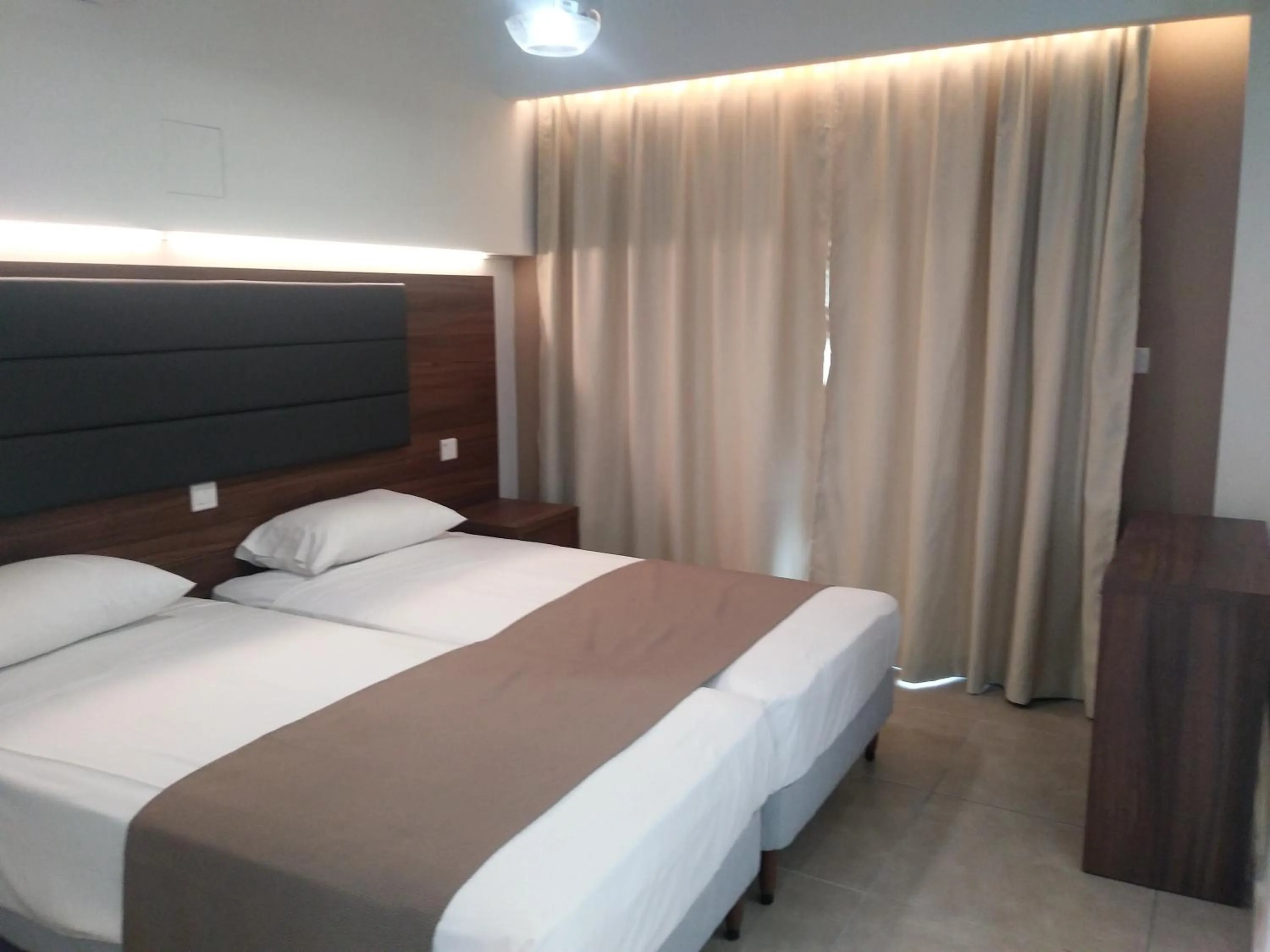 Bed in Livas Hotel Apartments