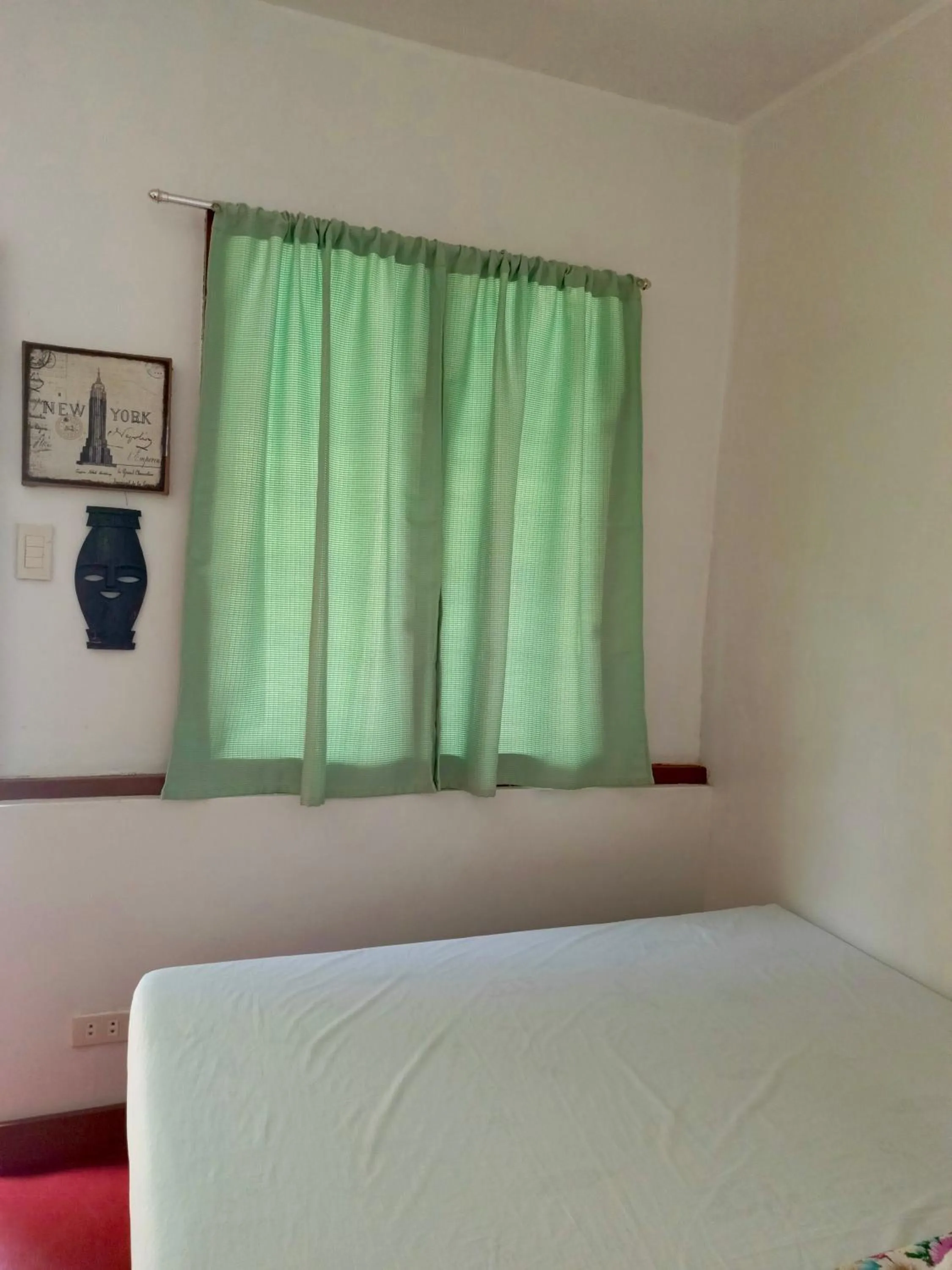 Bed in MiL's Hillside Tourist Inn