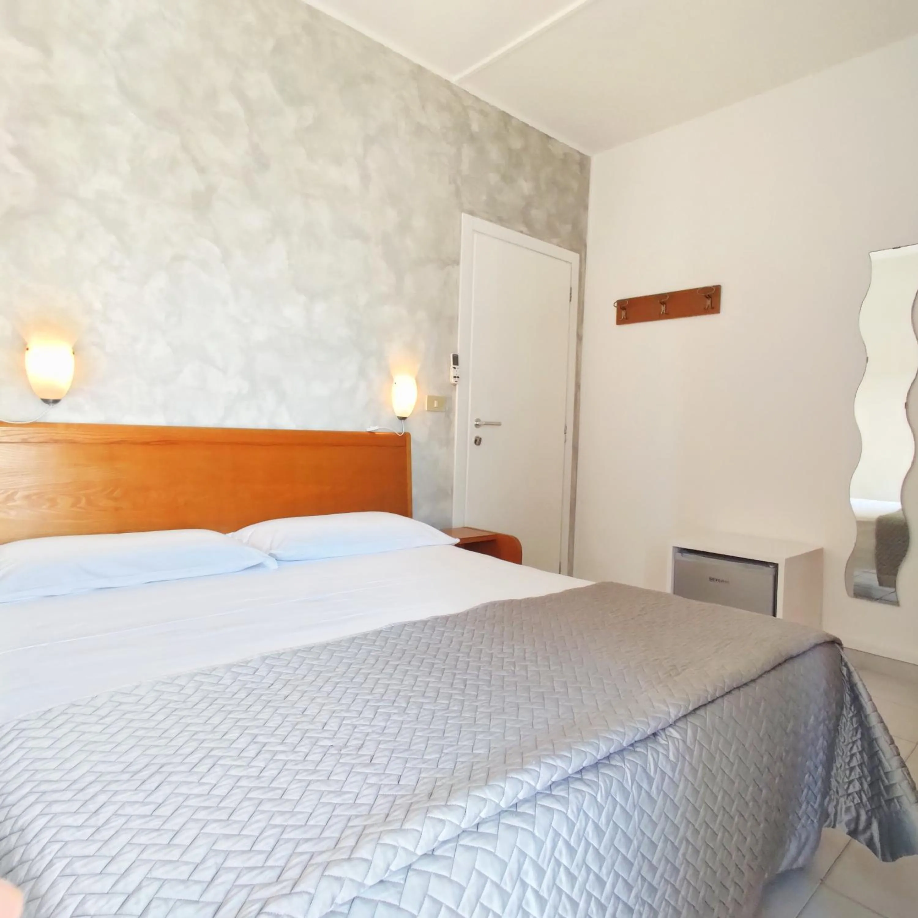 Bed in Piccolo Hotel