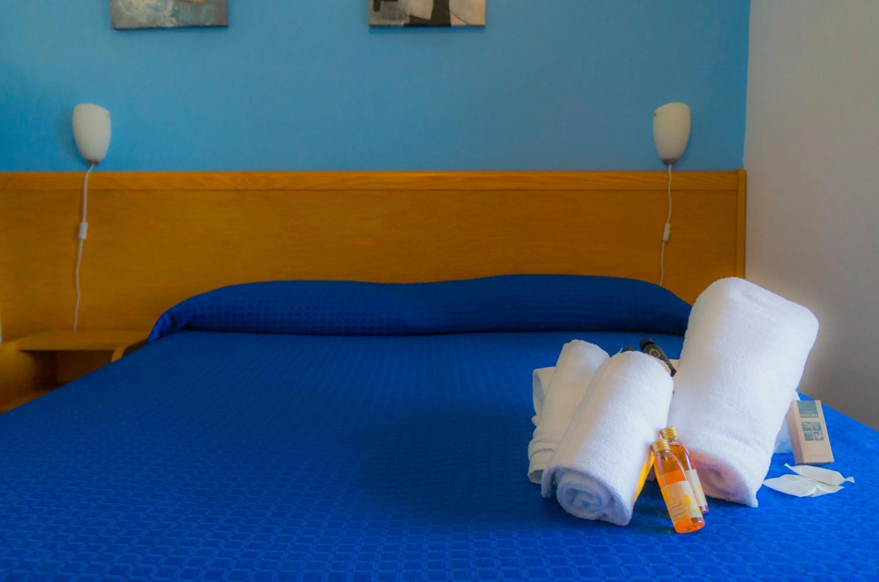 Bed in Piccolo Hotel