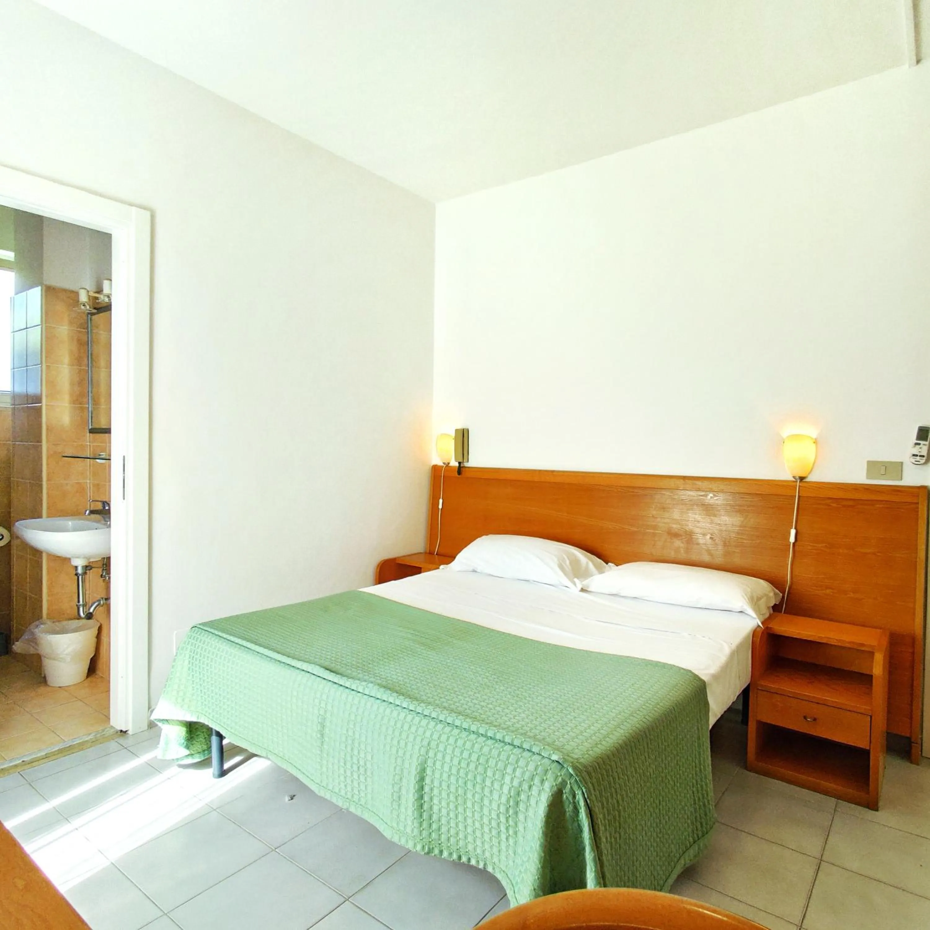 Bed in Piccolo Hotel