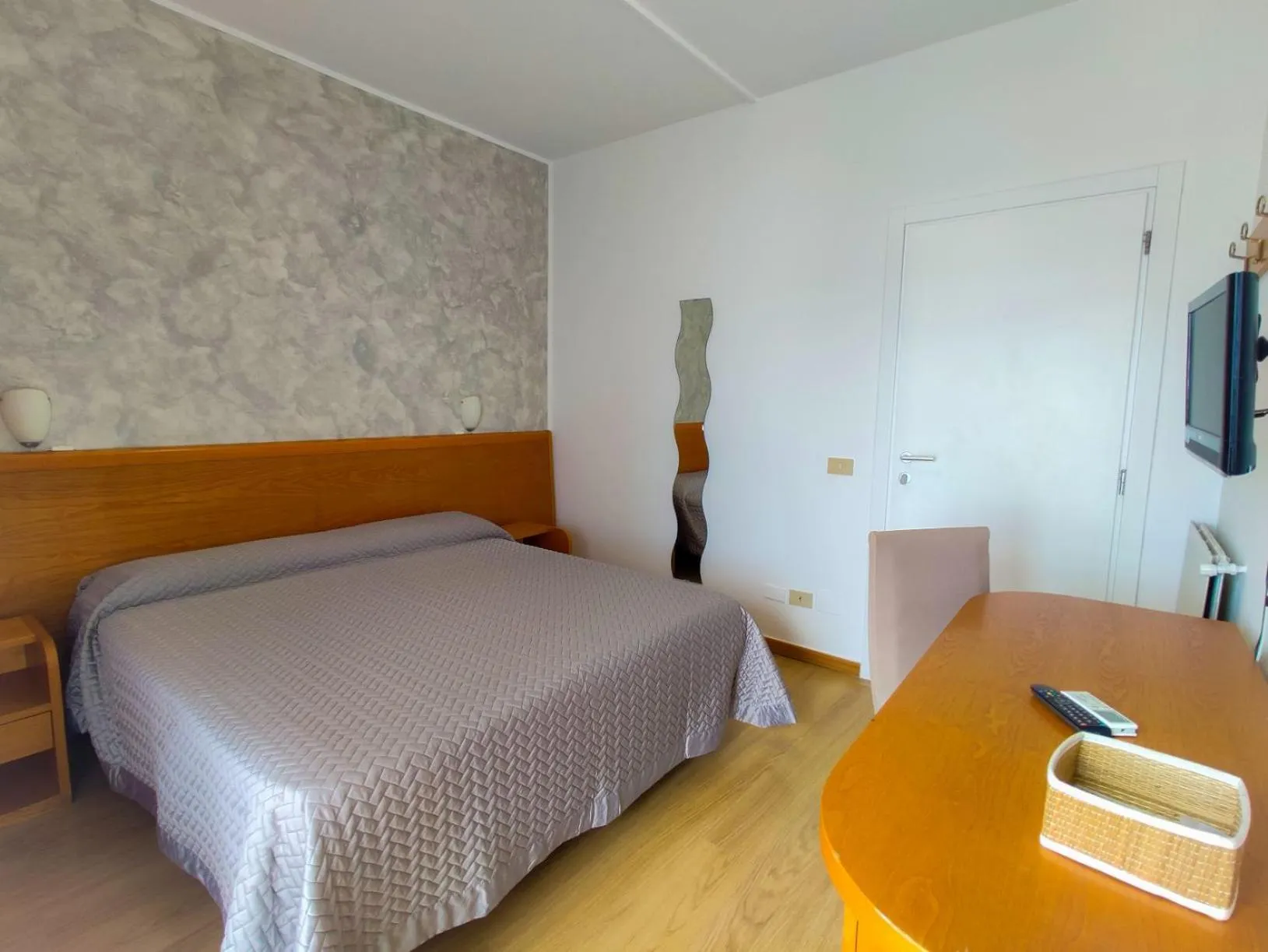 Bed in Piccolo Hotel