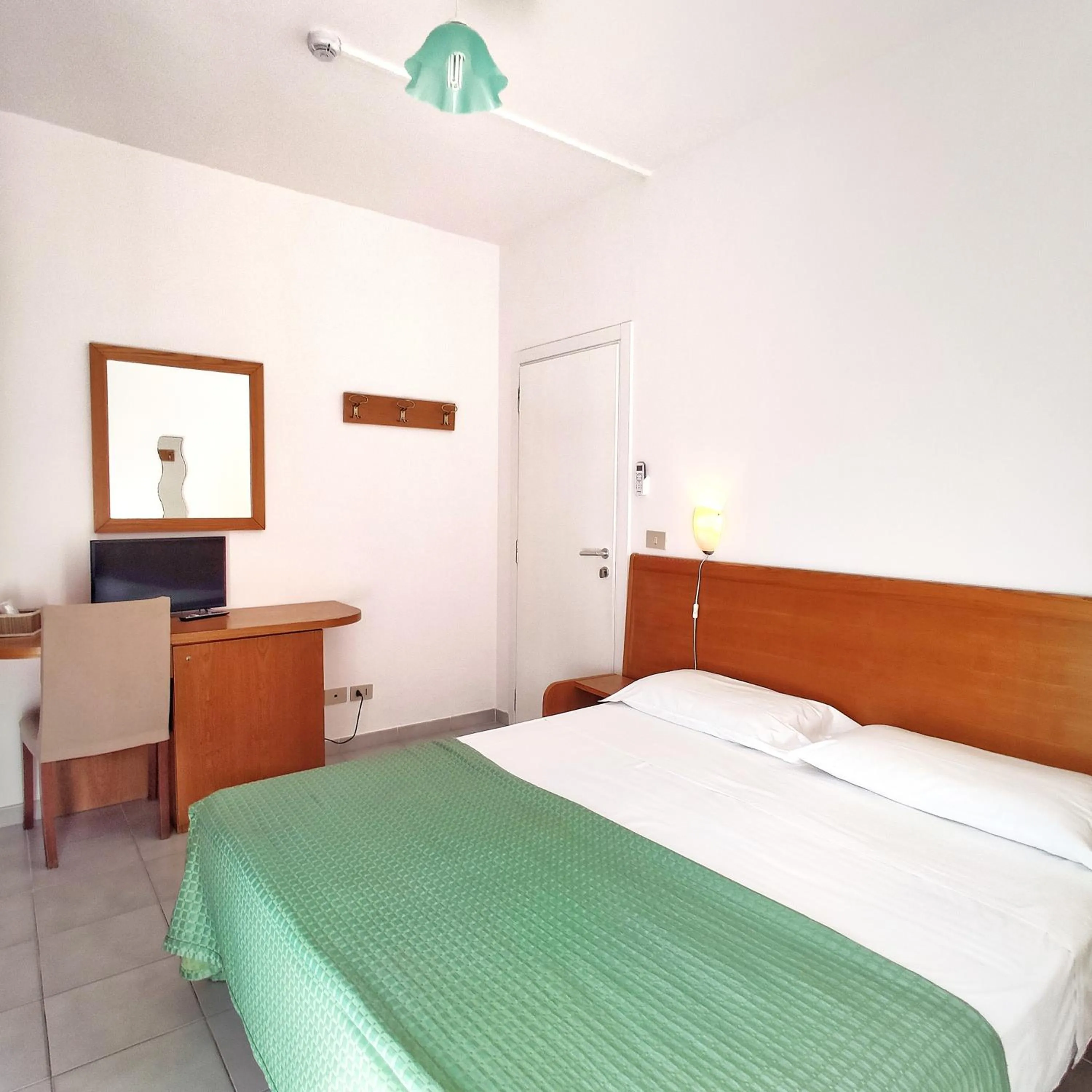 Bed in Piccolo Hotel