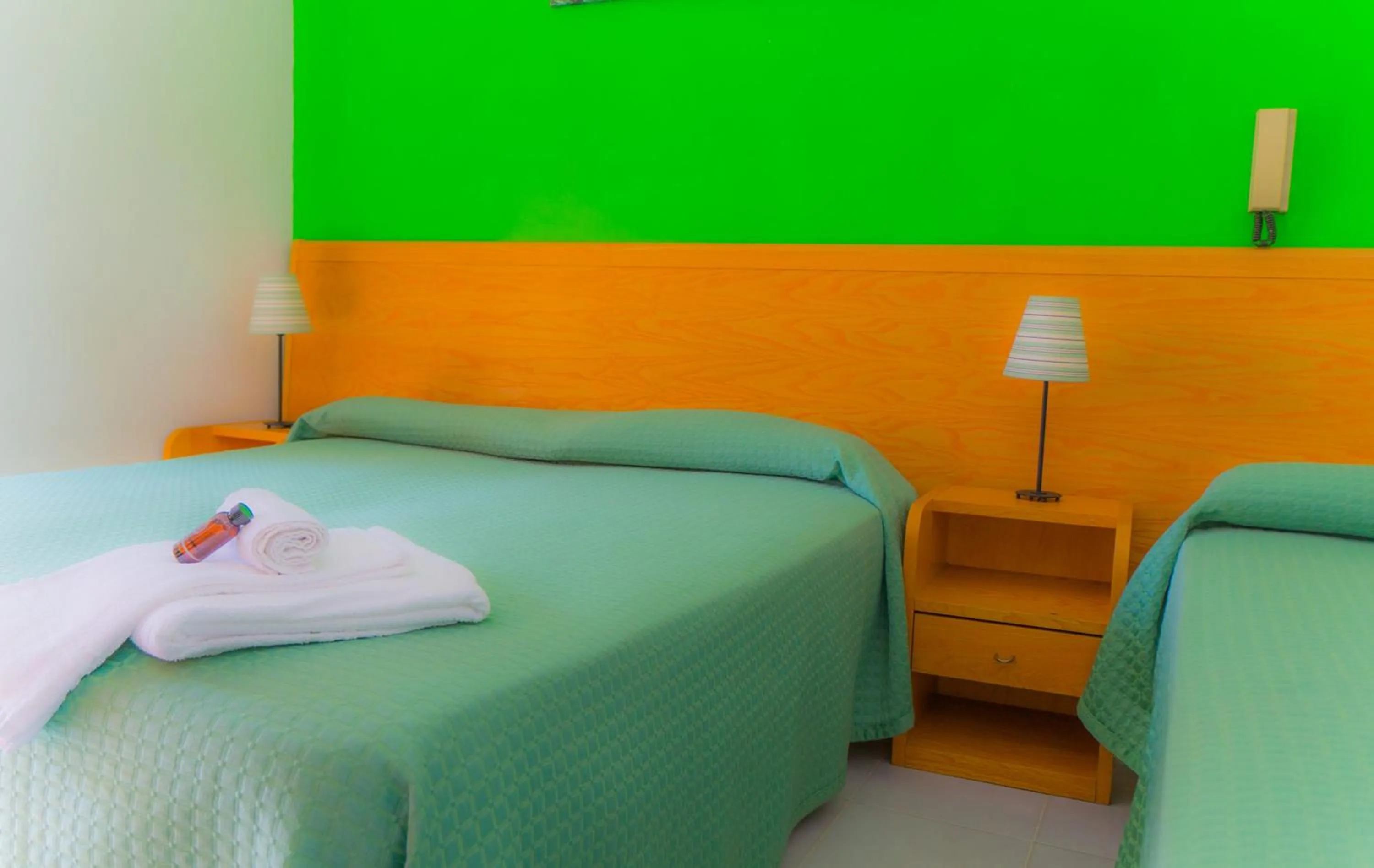 Bed in Piccolo Hotel