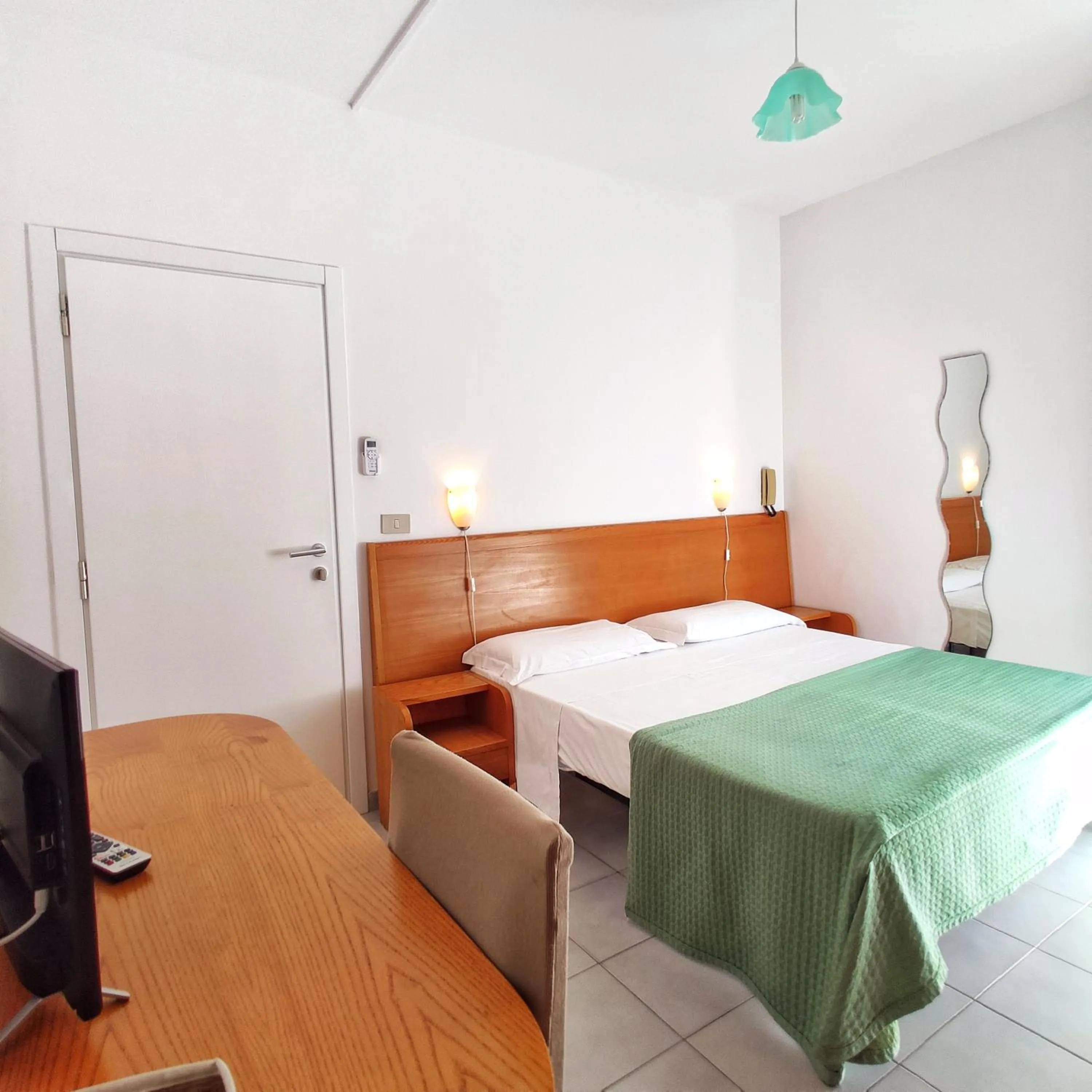 Bed in Piccolo Hotel