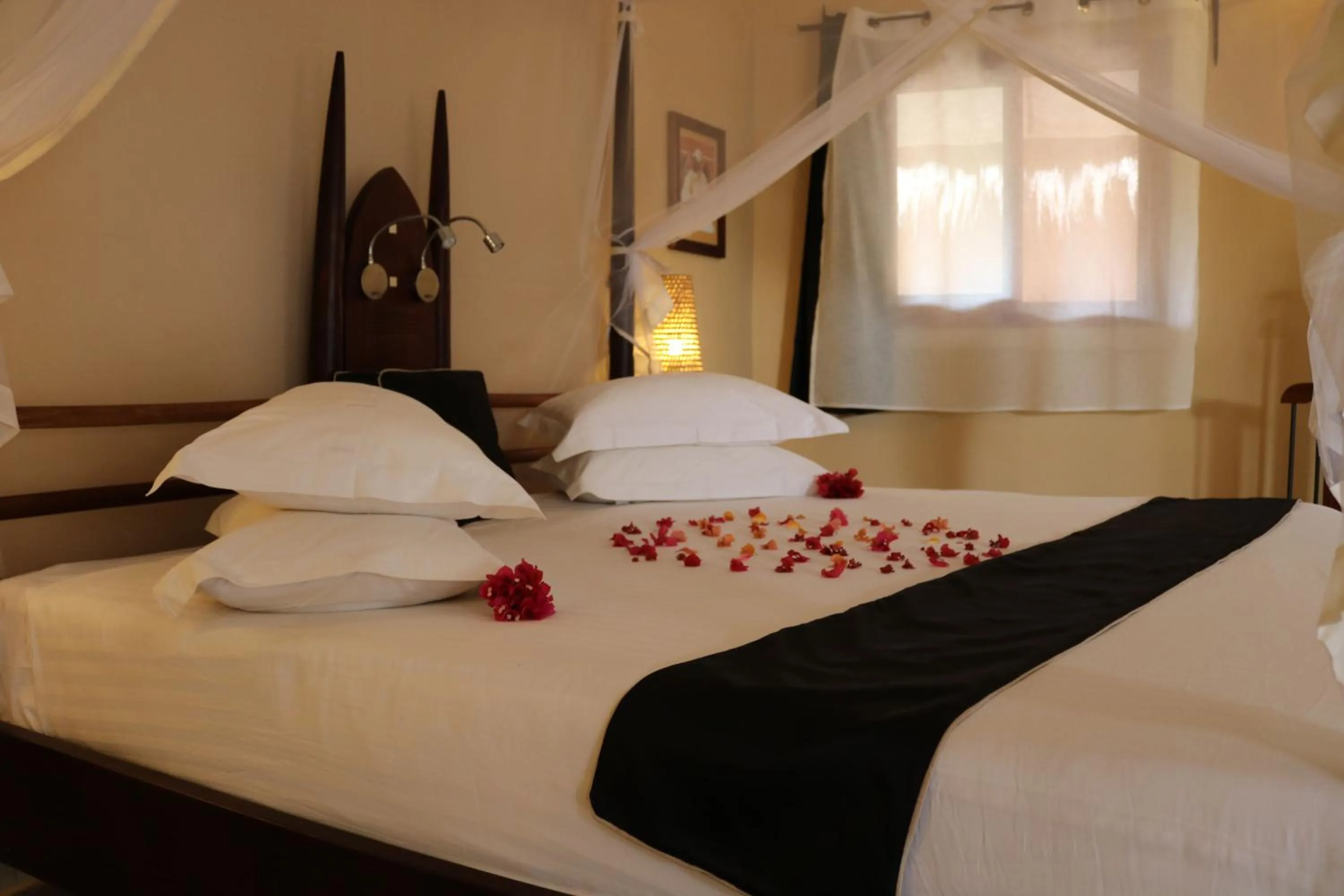 Photo of the whole room, Bed in Movenpick Resort Lamantin Saly