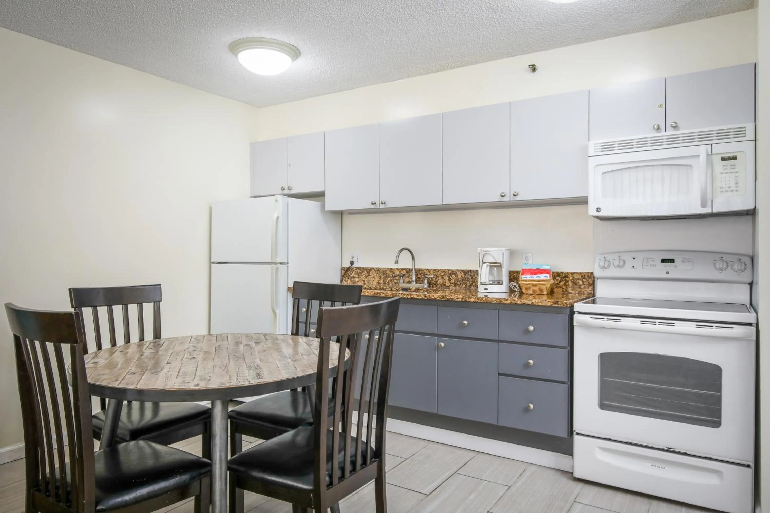 Kitchen or kitchenette in Aston at the Waikiki Banyan