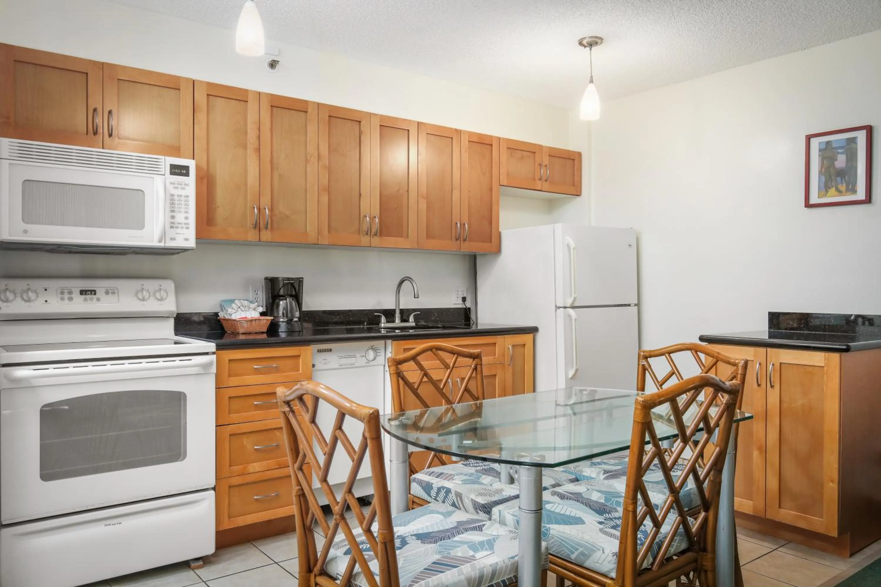 Kitchen or kitchenette in Aston at the Waikiki Banyan