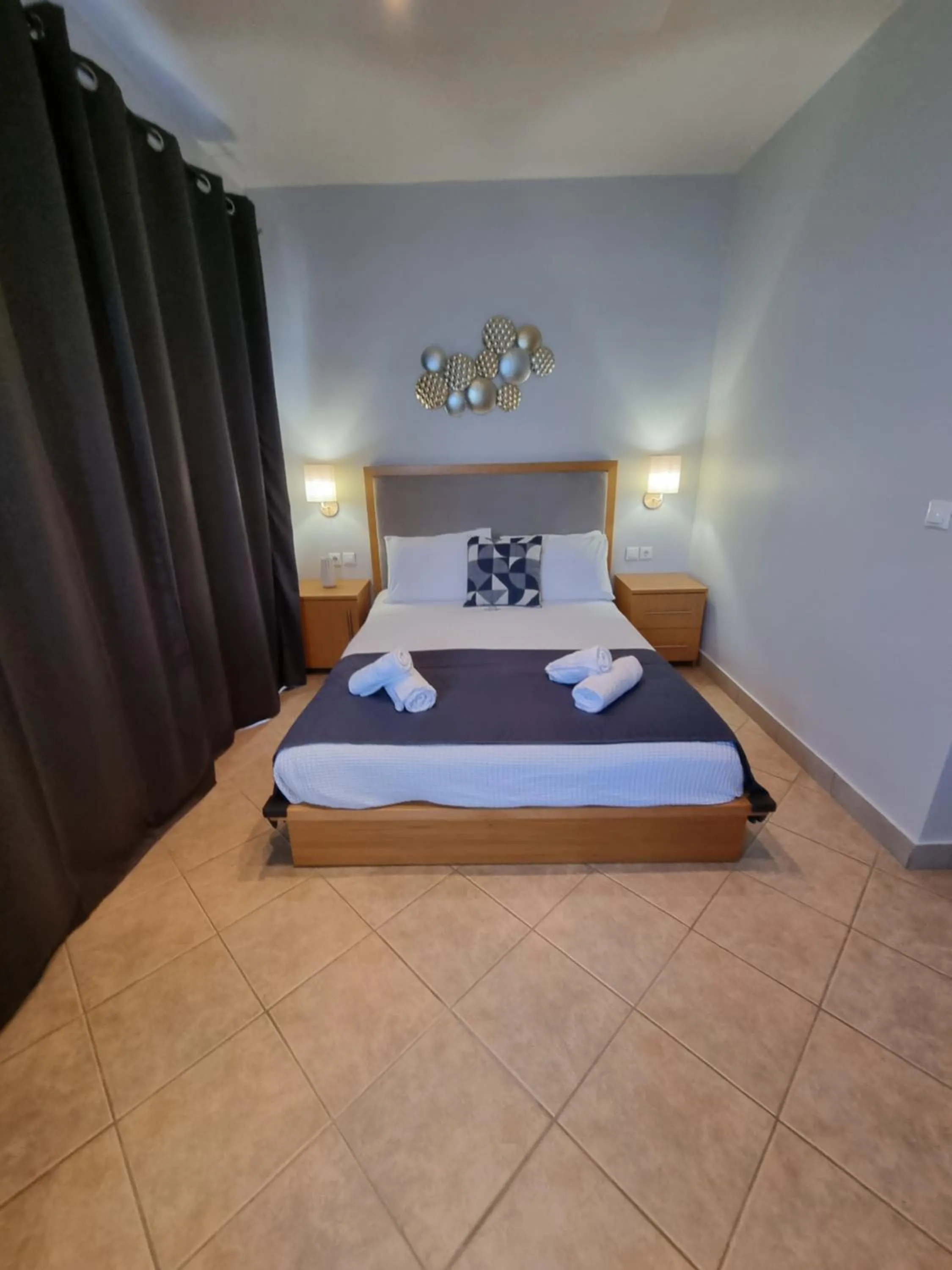 Bed in GreenHill Holiday Suites