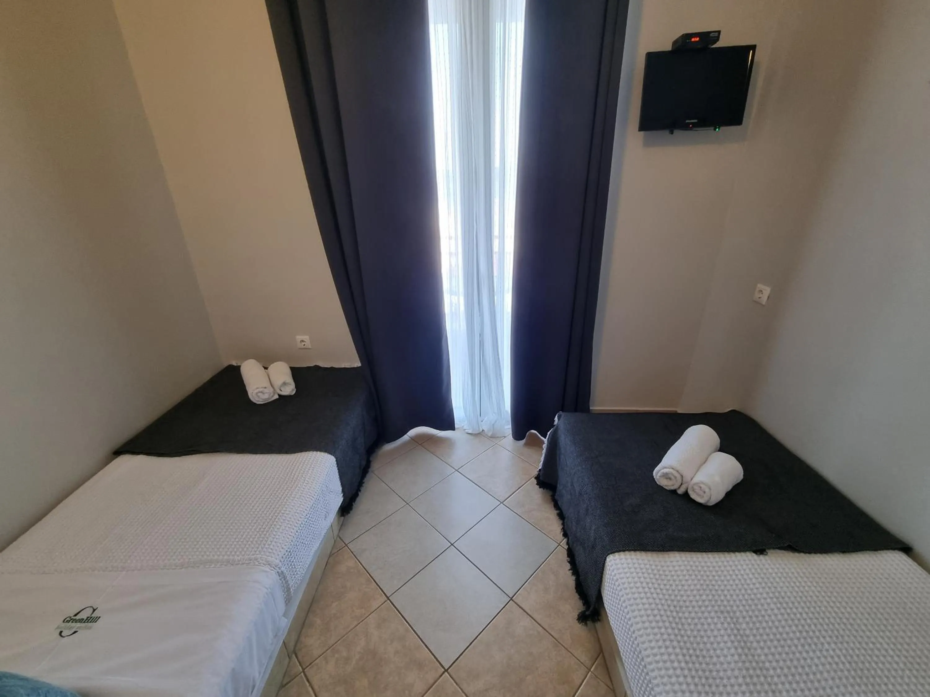 Bed in GreenHill Holiday Suites
