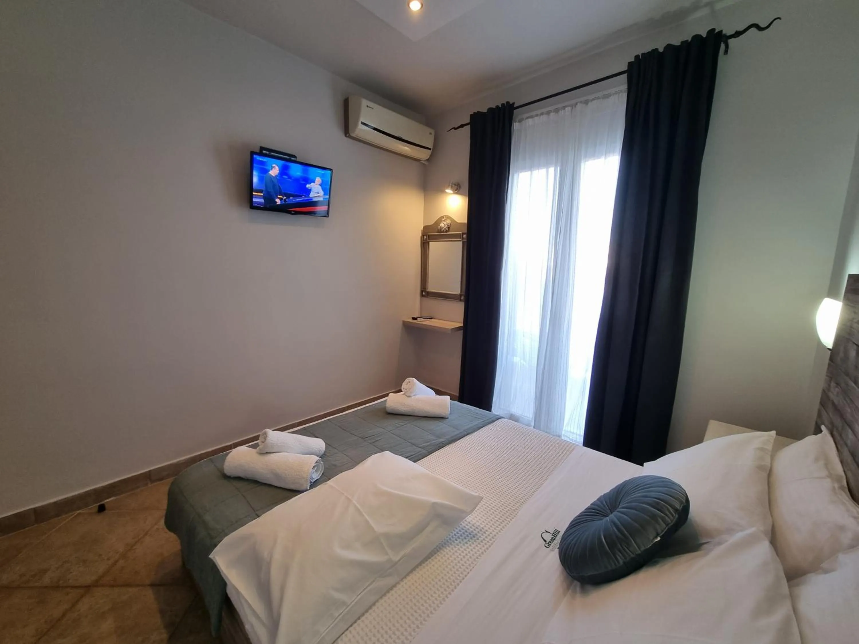 Bed in GreenHill Holiday Suites