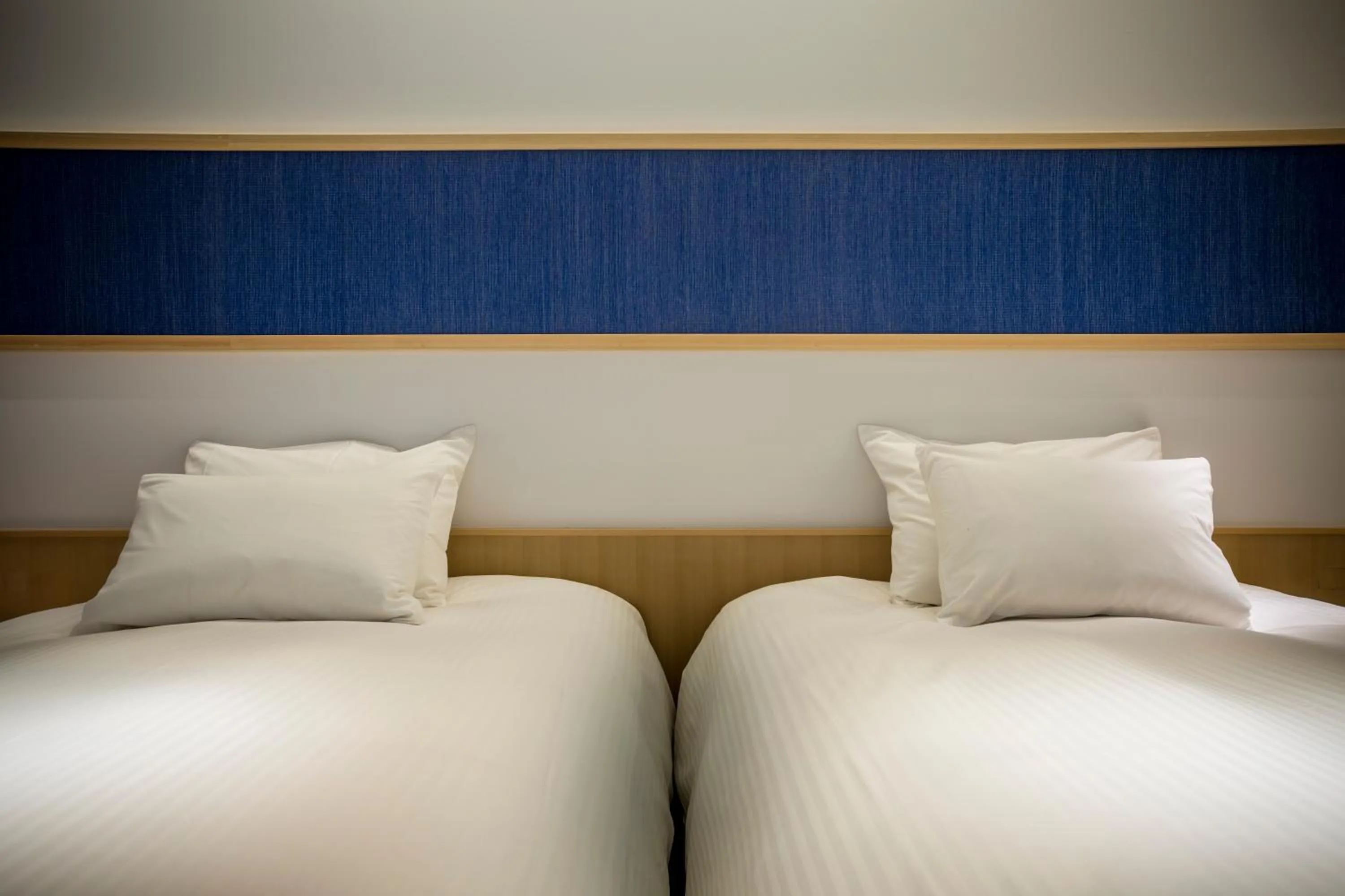 Bed in Hotel Kitanoya