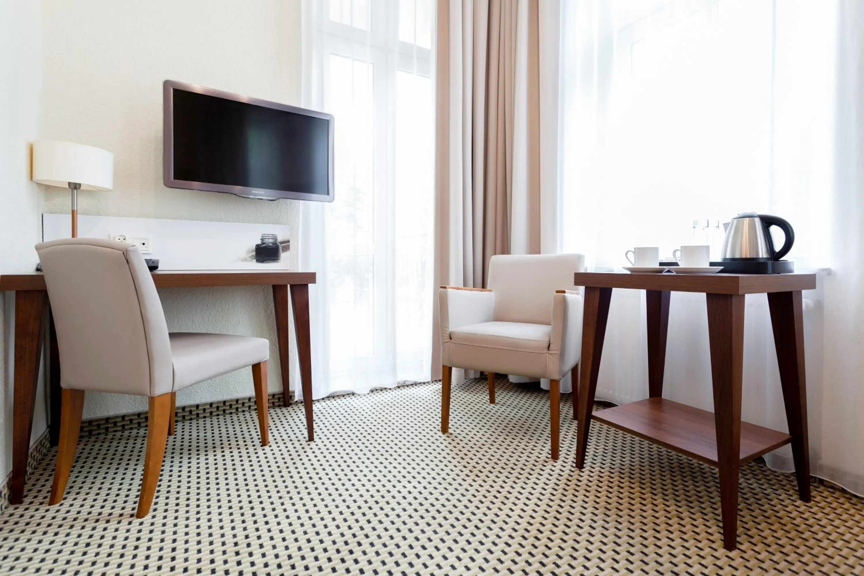 Seating area in Jantar Hotel & SPA by Zdrojowa