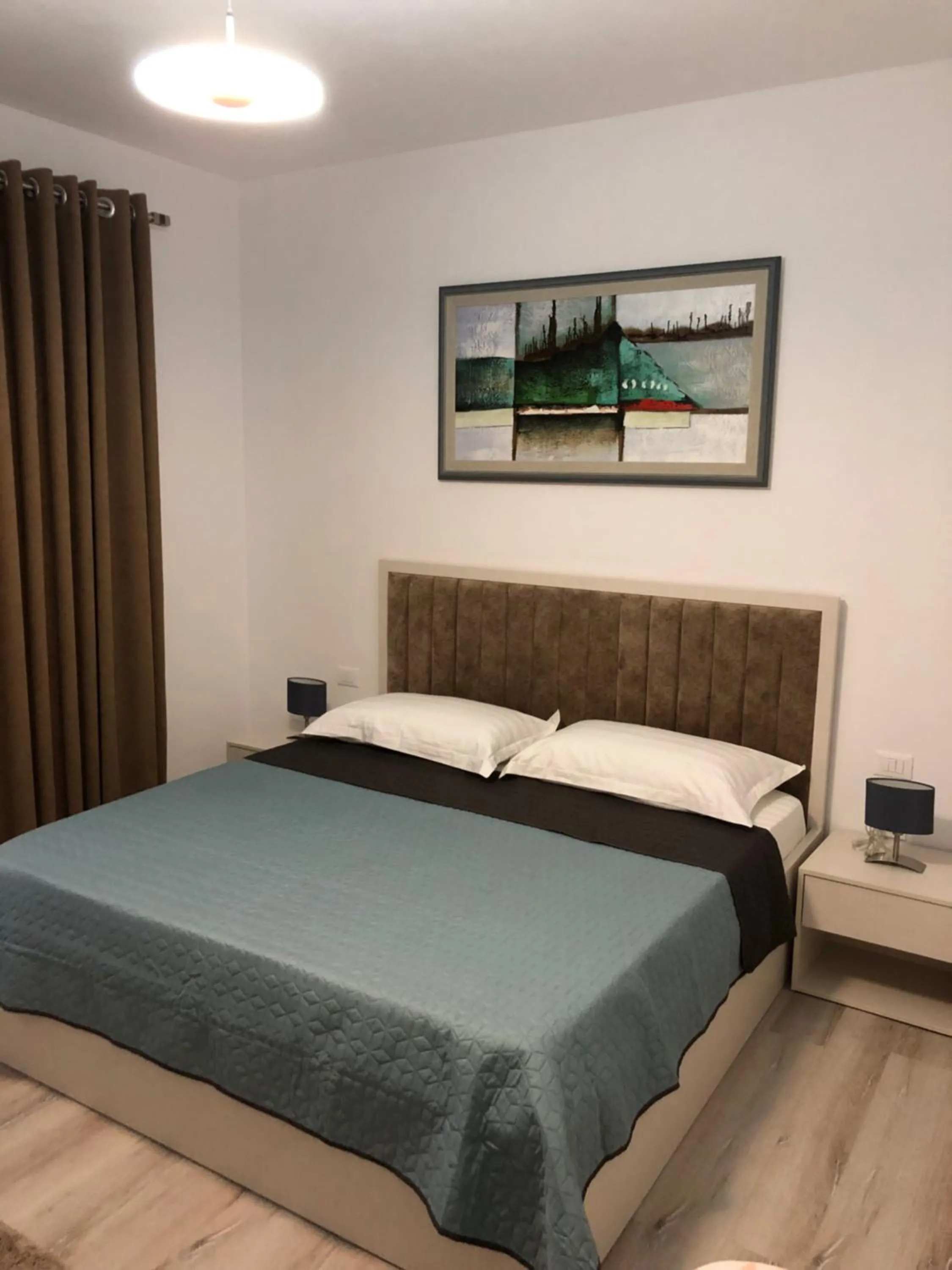 Bed in Brilant Apartament