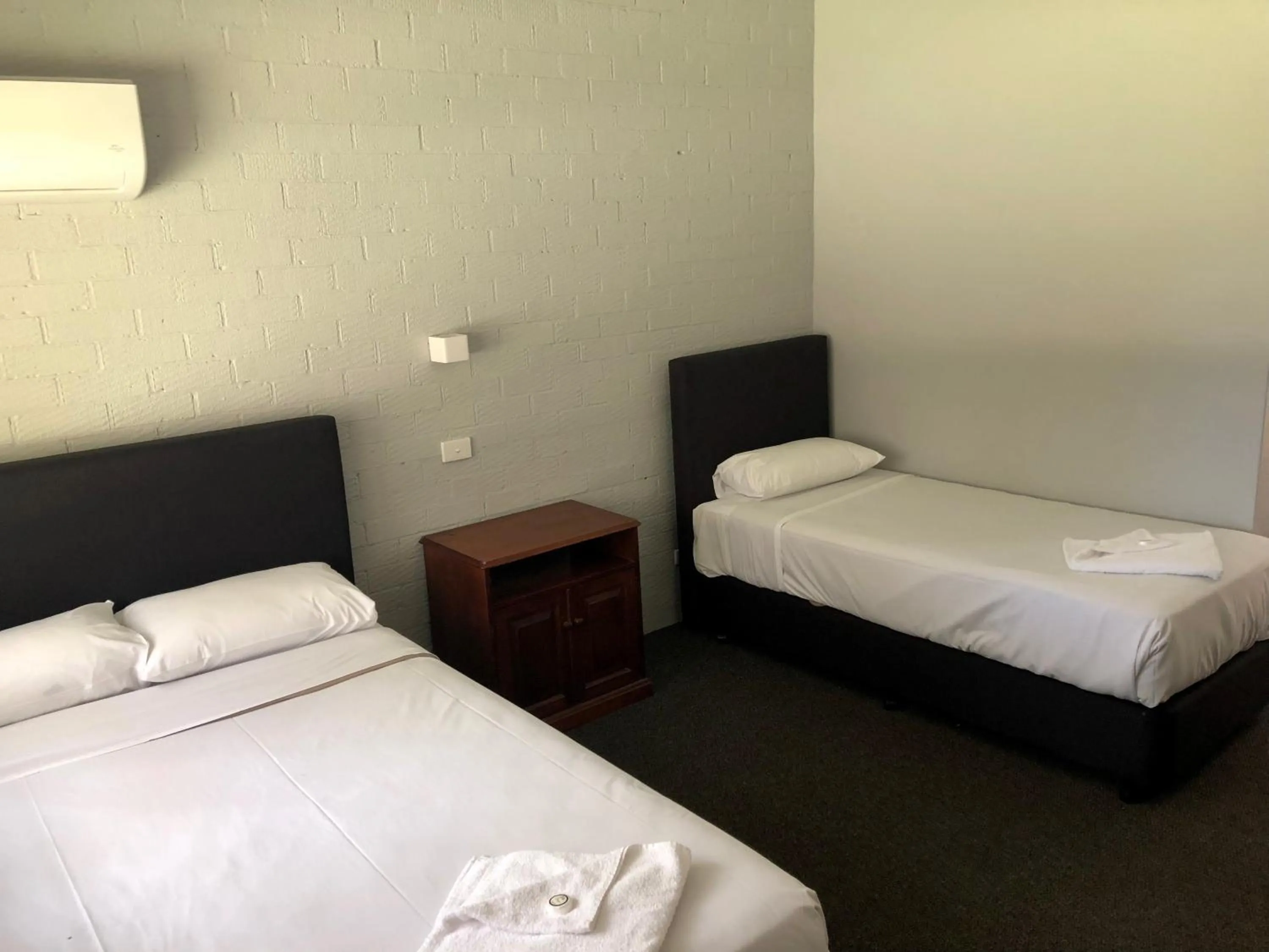 Bed in Bateau Bay Hotel