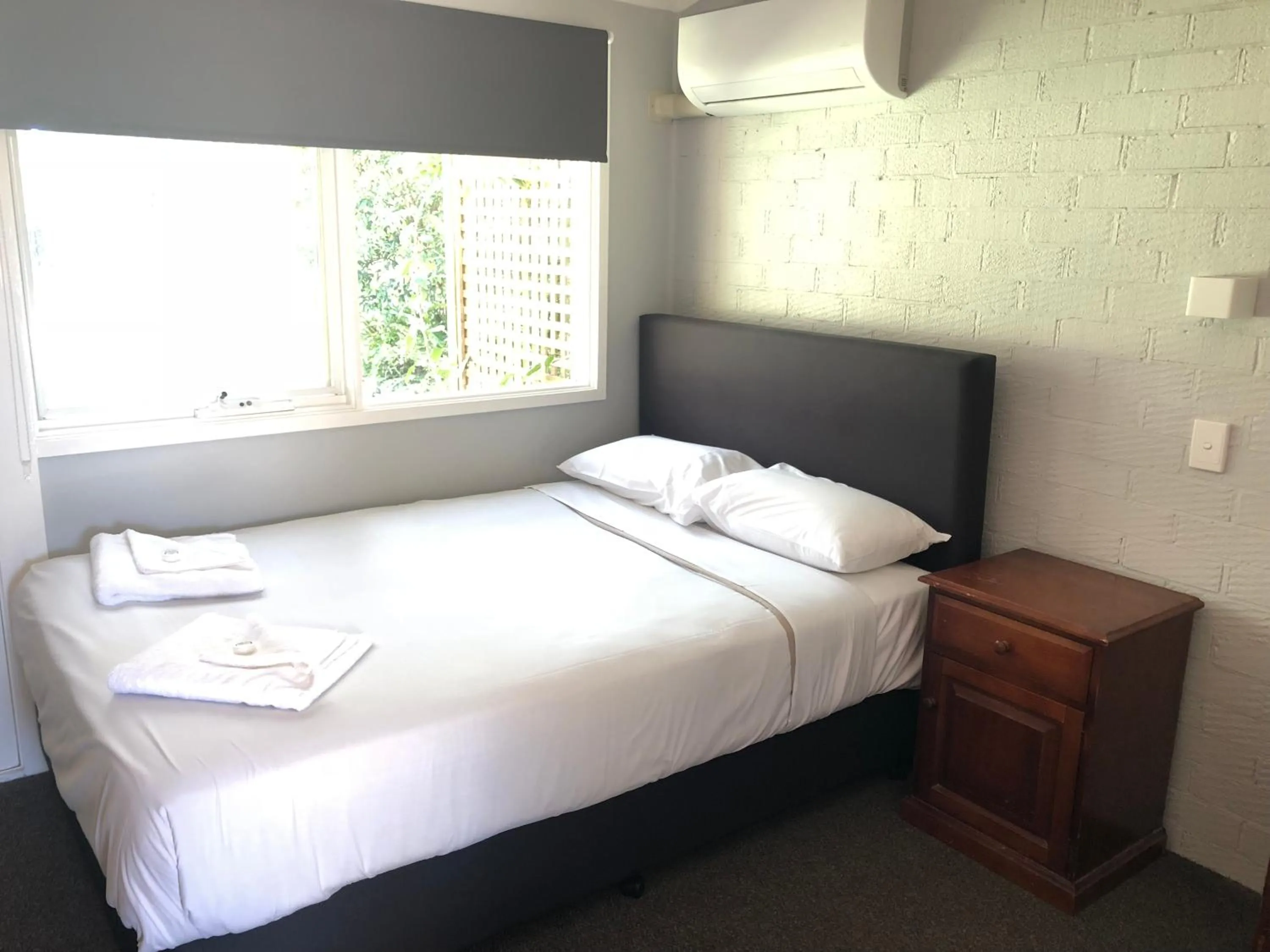 Bed in Bateau Bay Hotel