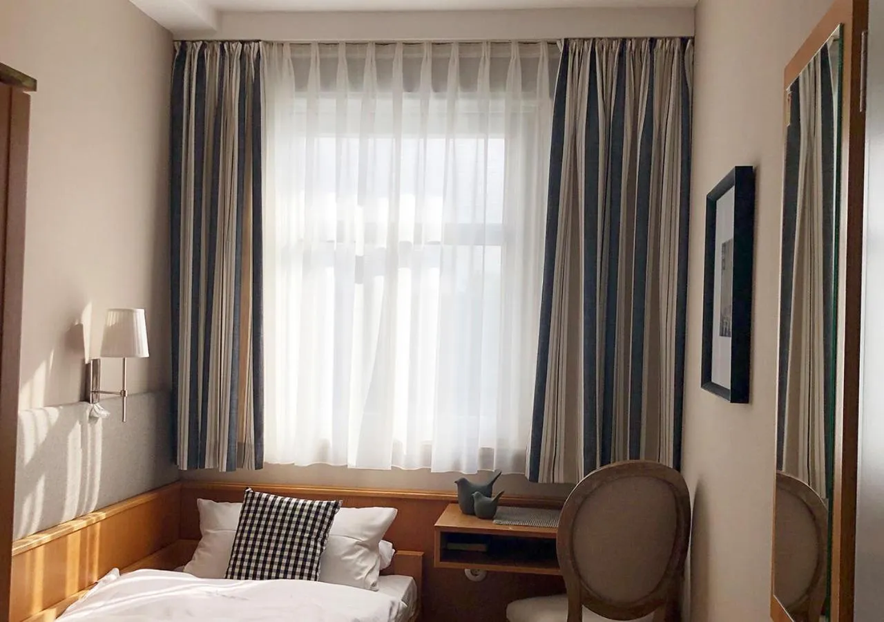 Bed in Mangolds Boutique Hotel & Fruehstuecksmeisterei