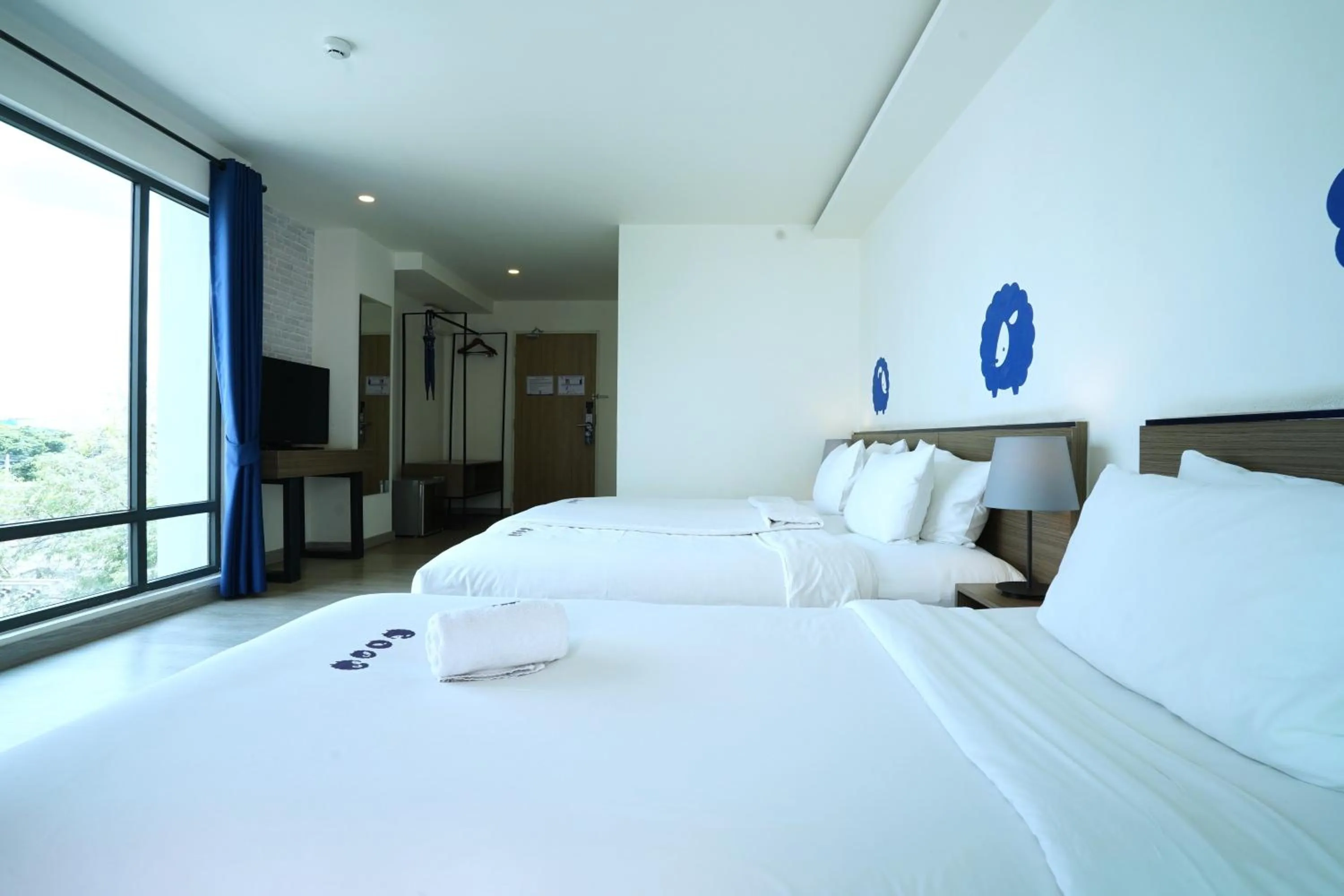 Bed in Kokotel Chiang Mai Nimman