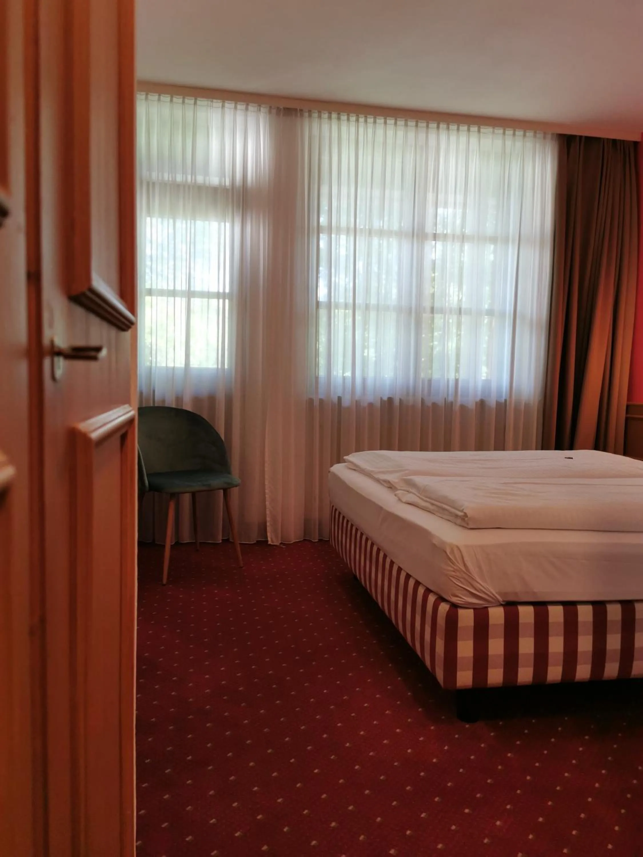 Photo of the whole room, Bed in Landhotel Ölmühle