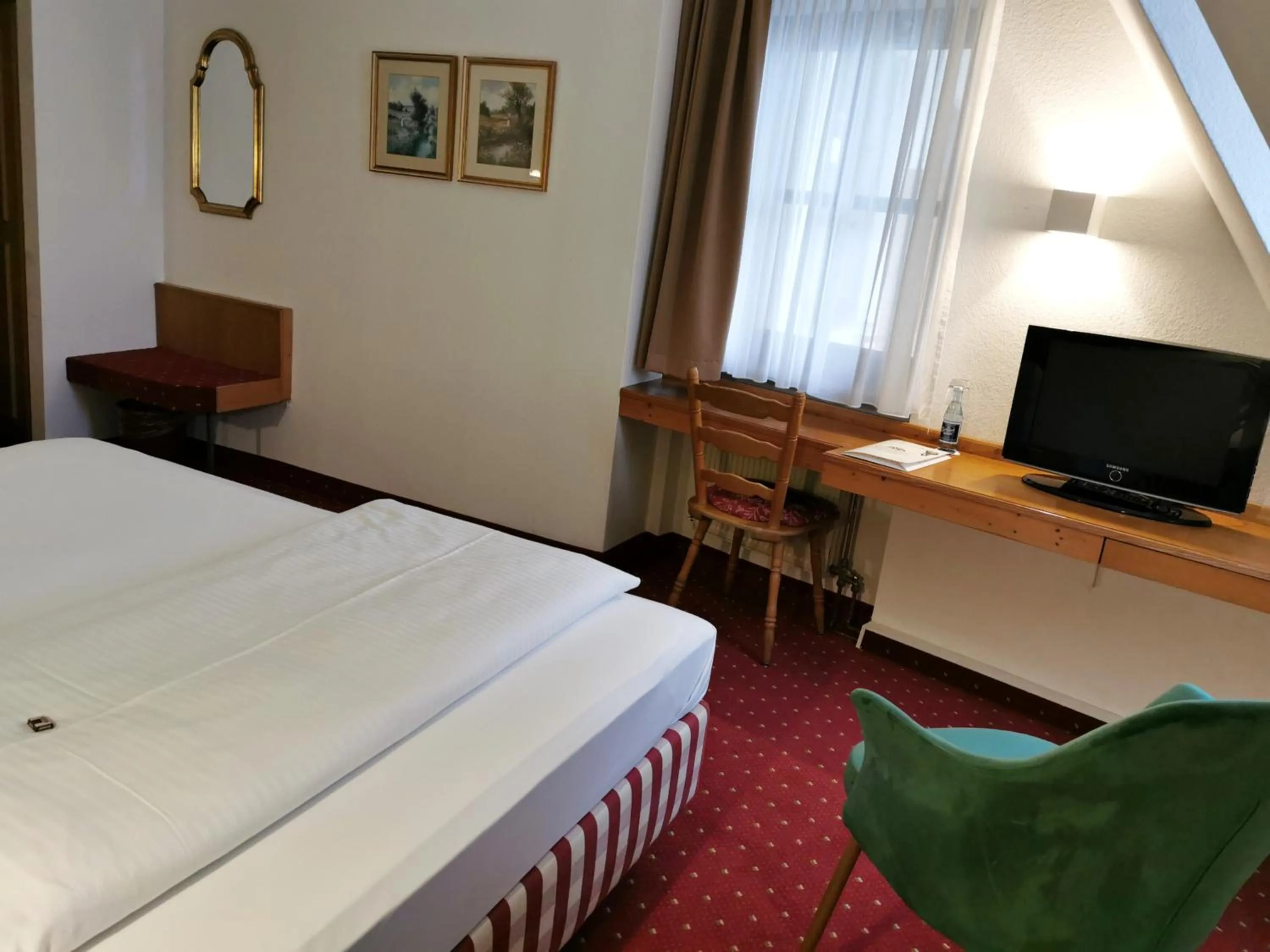 Photo of the whole room, Bed in Landhotel Ölmühle