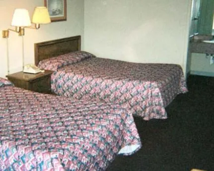 Bed in Royal Extended Stay