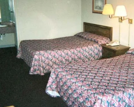 Bed in Royal Extended Stay