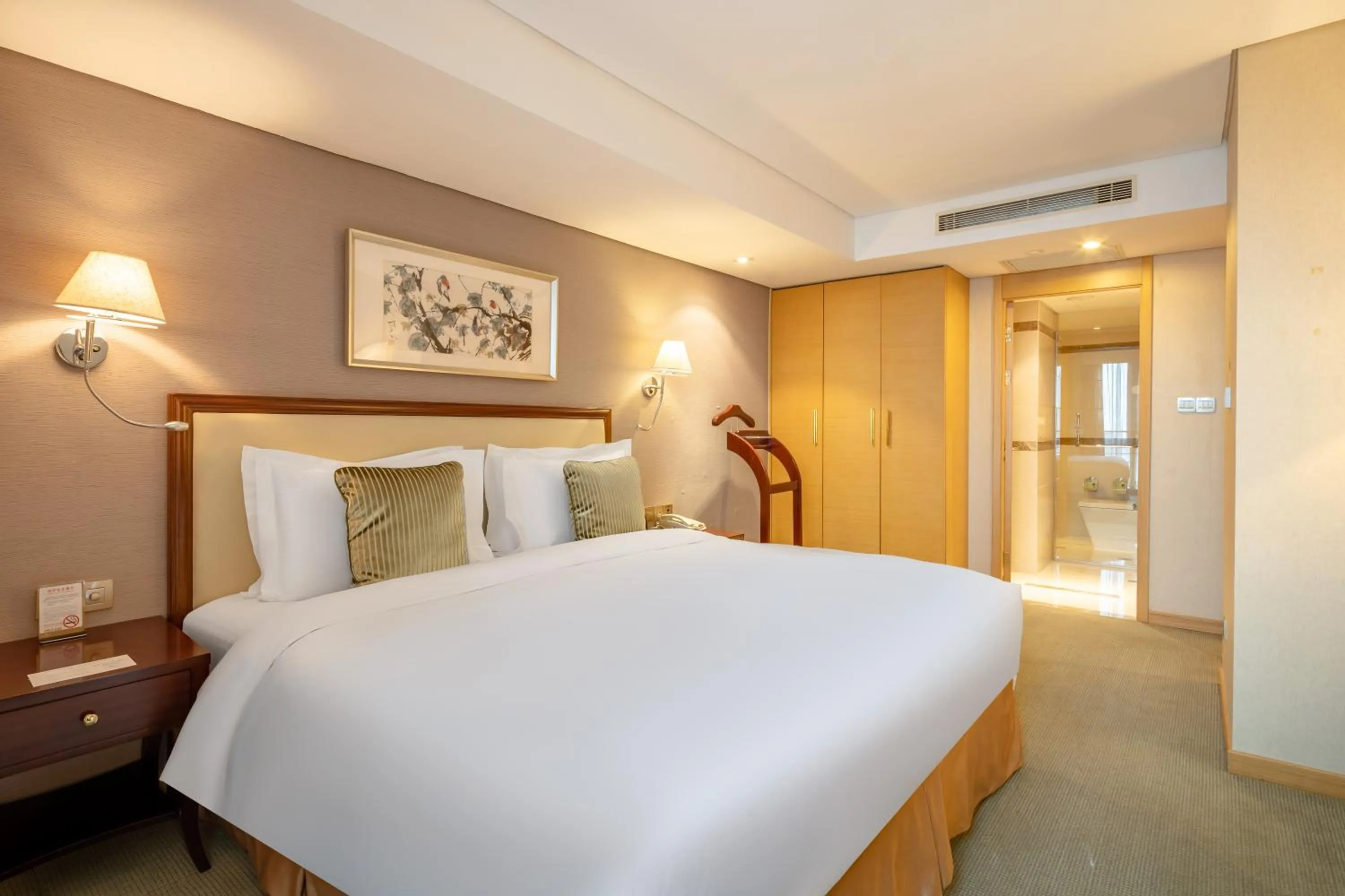 Bed in Regal Plaza Hotel & Residence