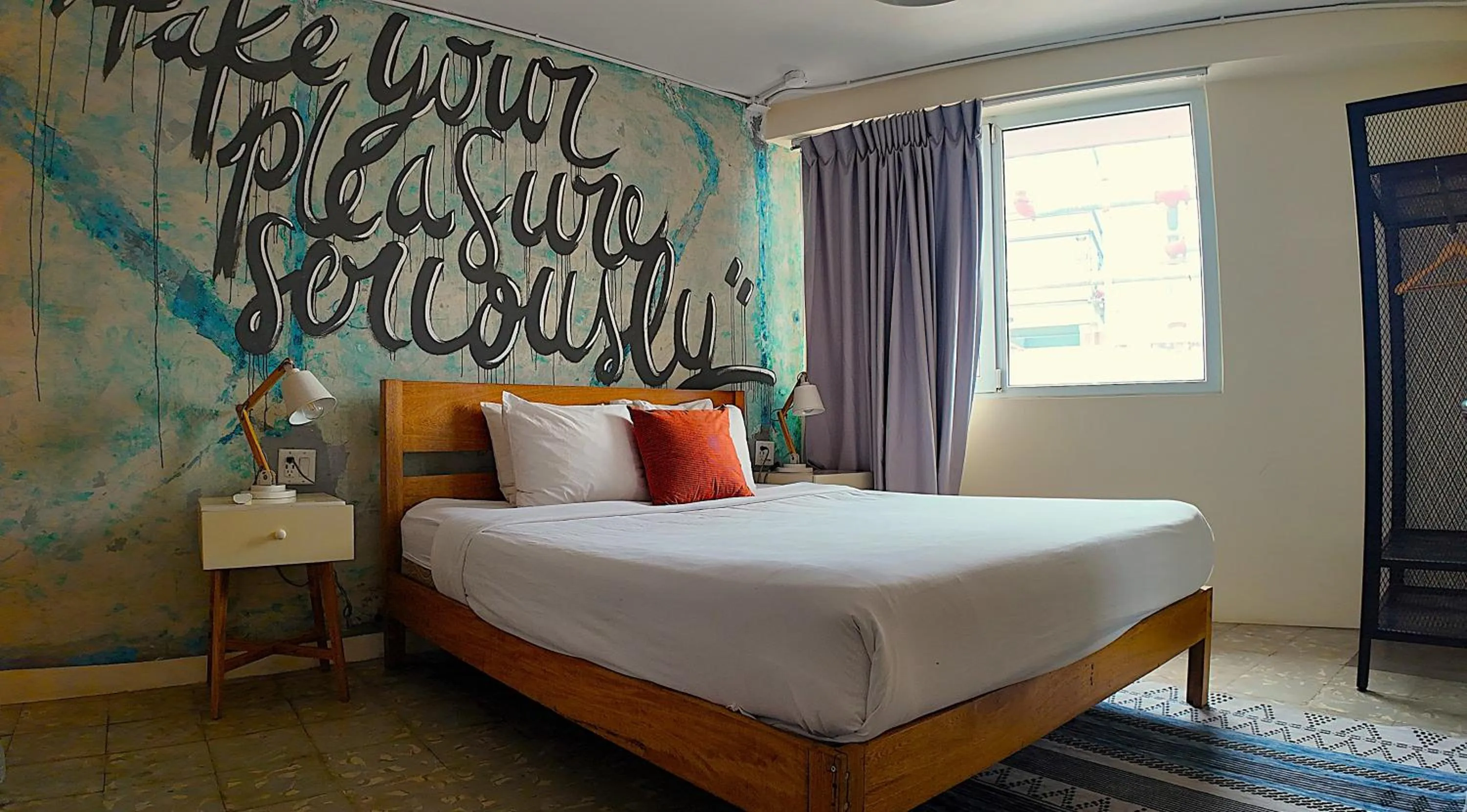 Photo of the whole room, Bed in Selina Casco Viejo Panama City