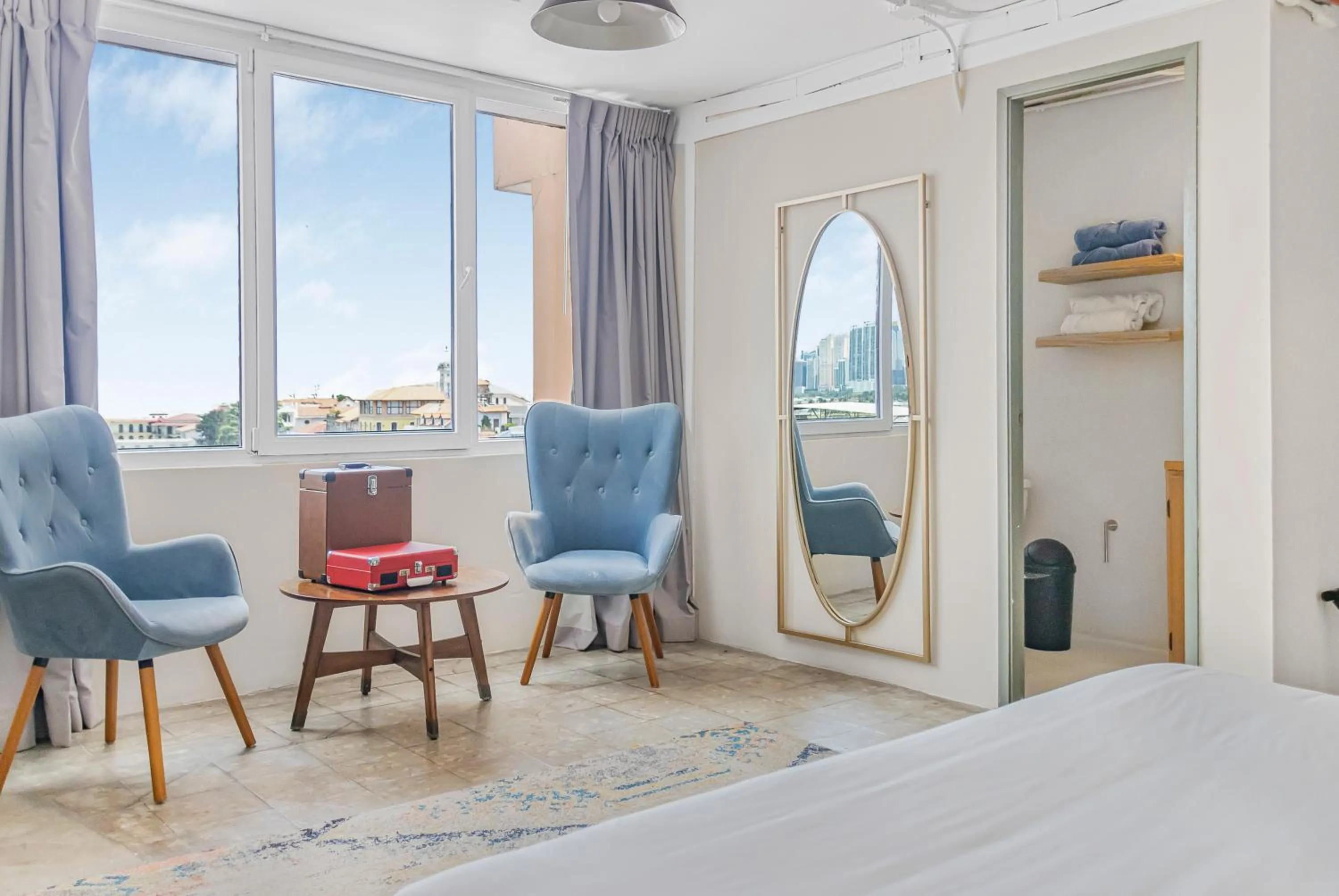 Seating area, Bed in Selina Casco Viejo Panama City